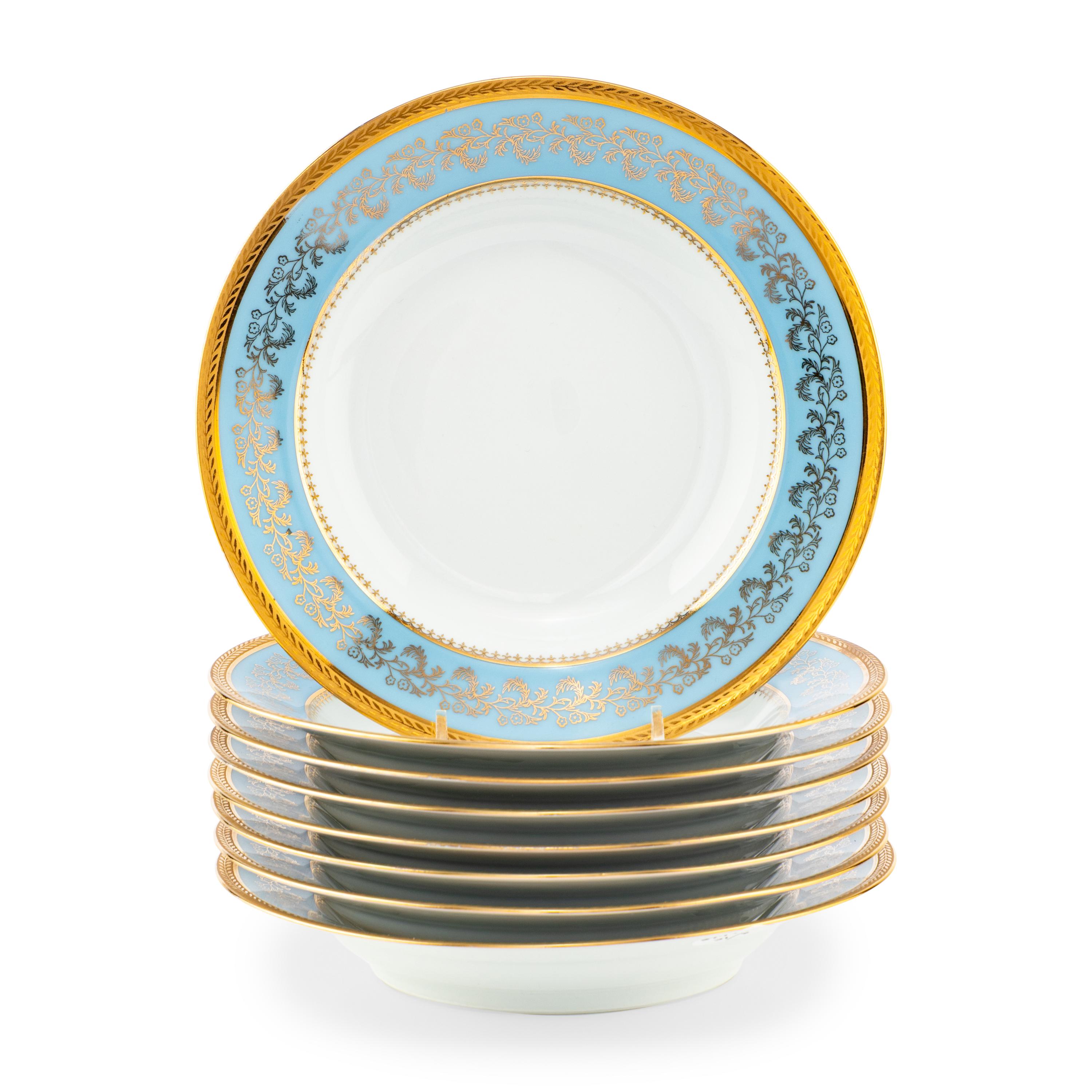 A Set of Eight Limoges Porcelain Soup Plates