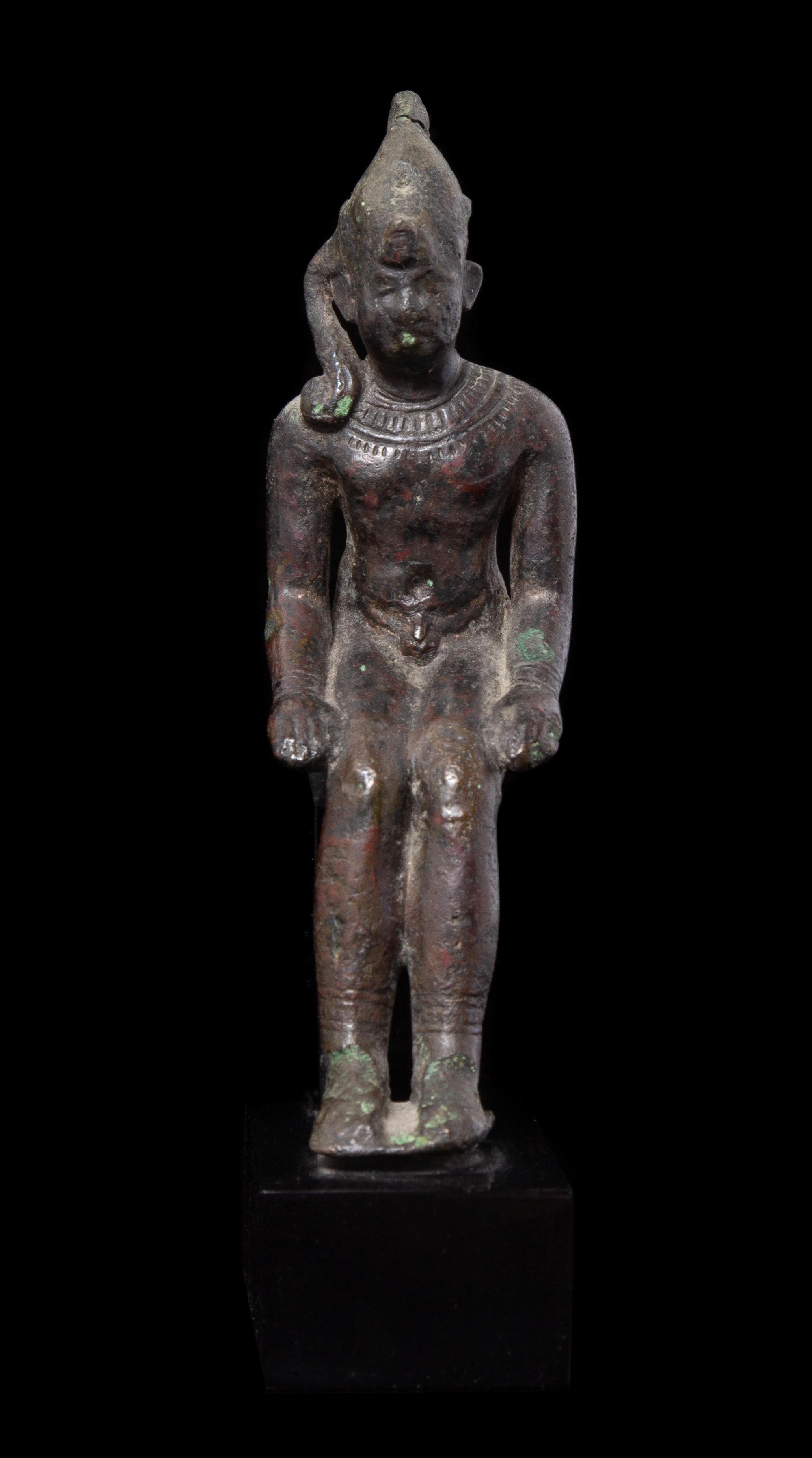 An Egyptian Bronze Seated Harpokrates Height 4 1/4 inches. — LATE PERIOD, DYNASTY 26-30, 664-343 B.C.E.