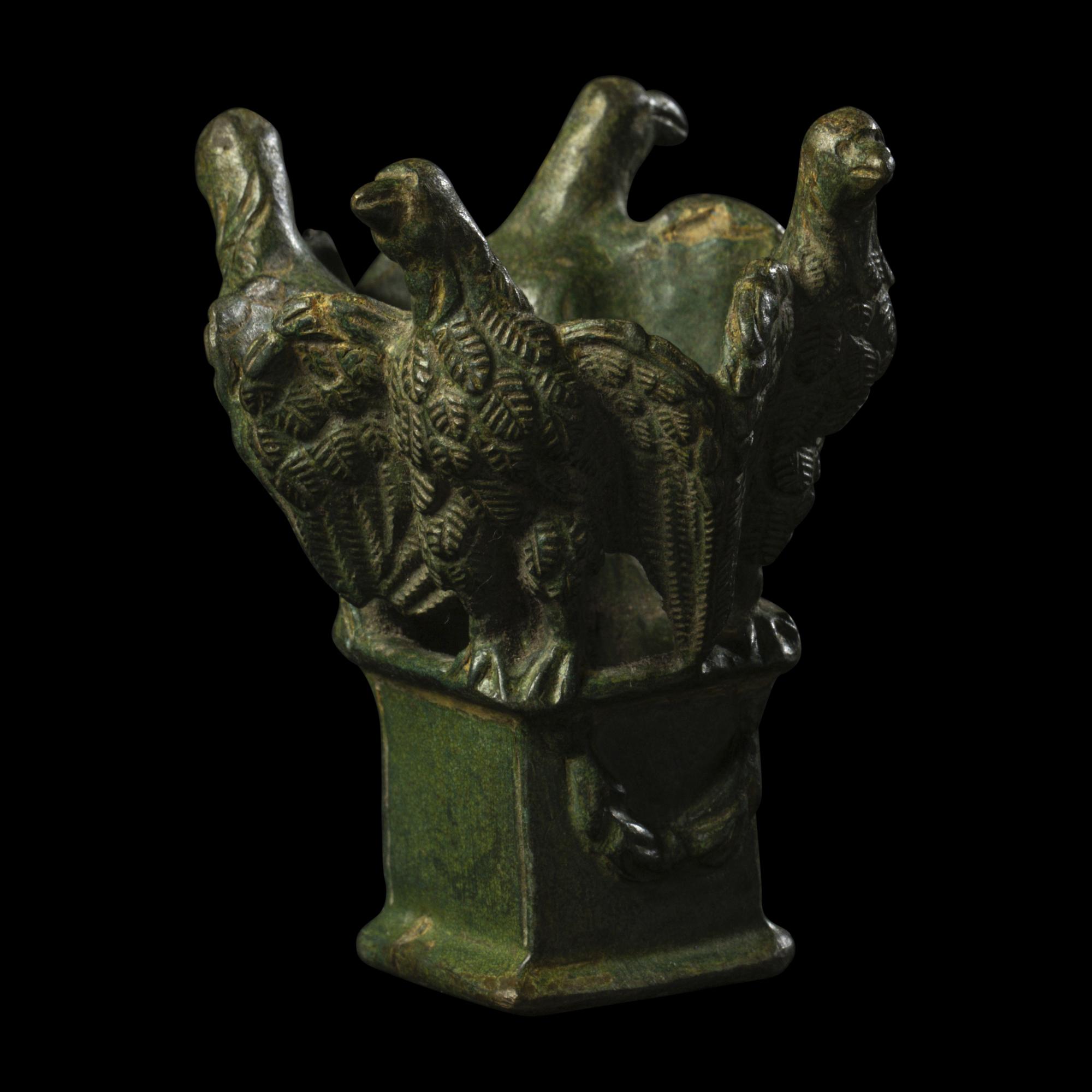 A Roman Bronze Lamp Stand with Four Eagles