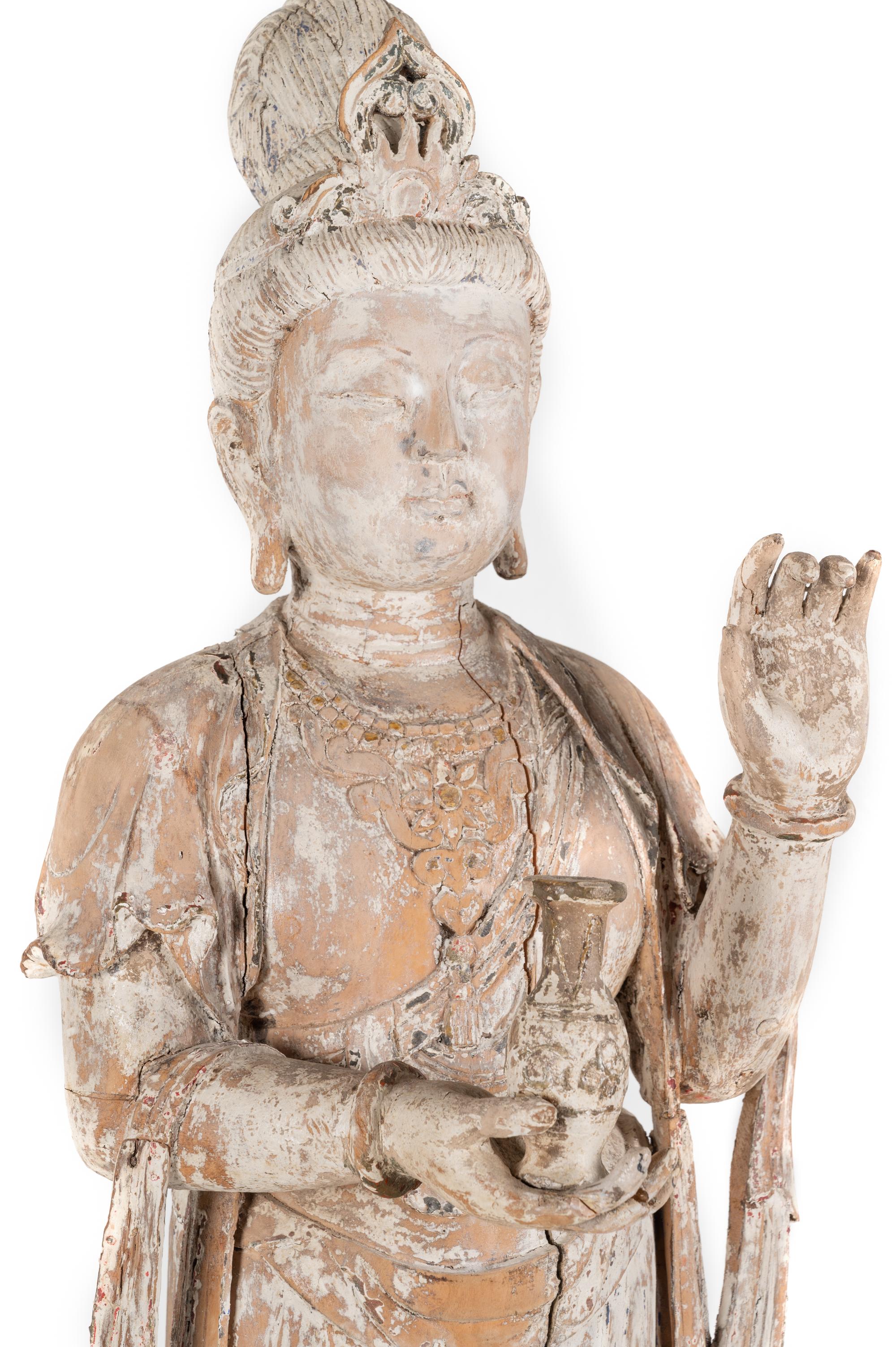 A Chinese Carved Wood Figure of Standing Guanyin