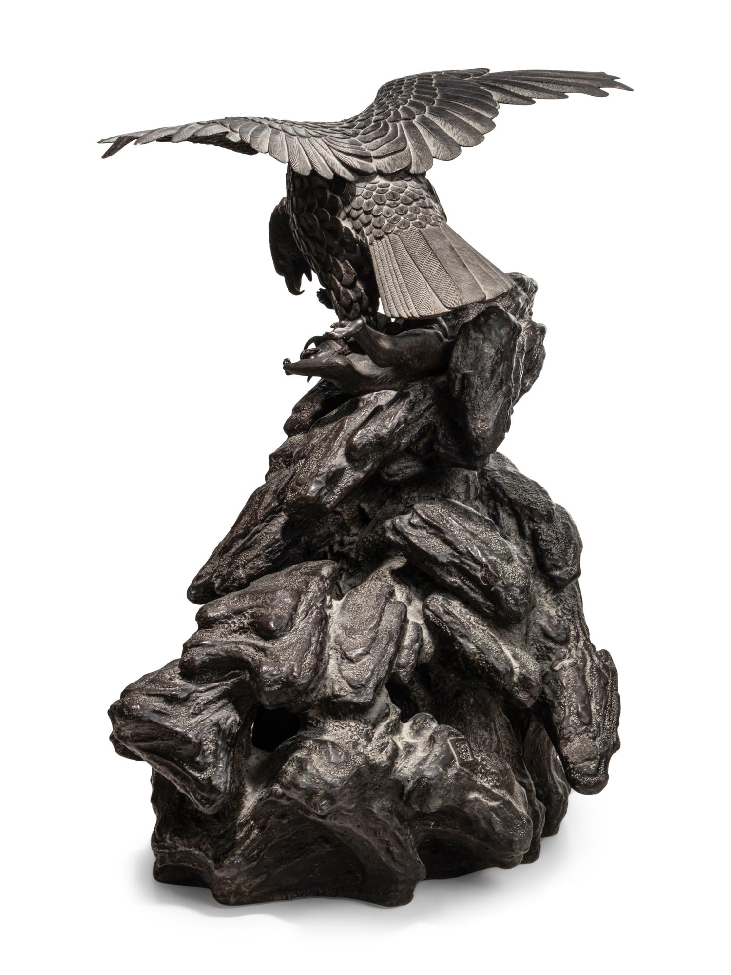 A Japanese Bronze Figural Group of a Hawk Hunting Monkeys