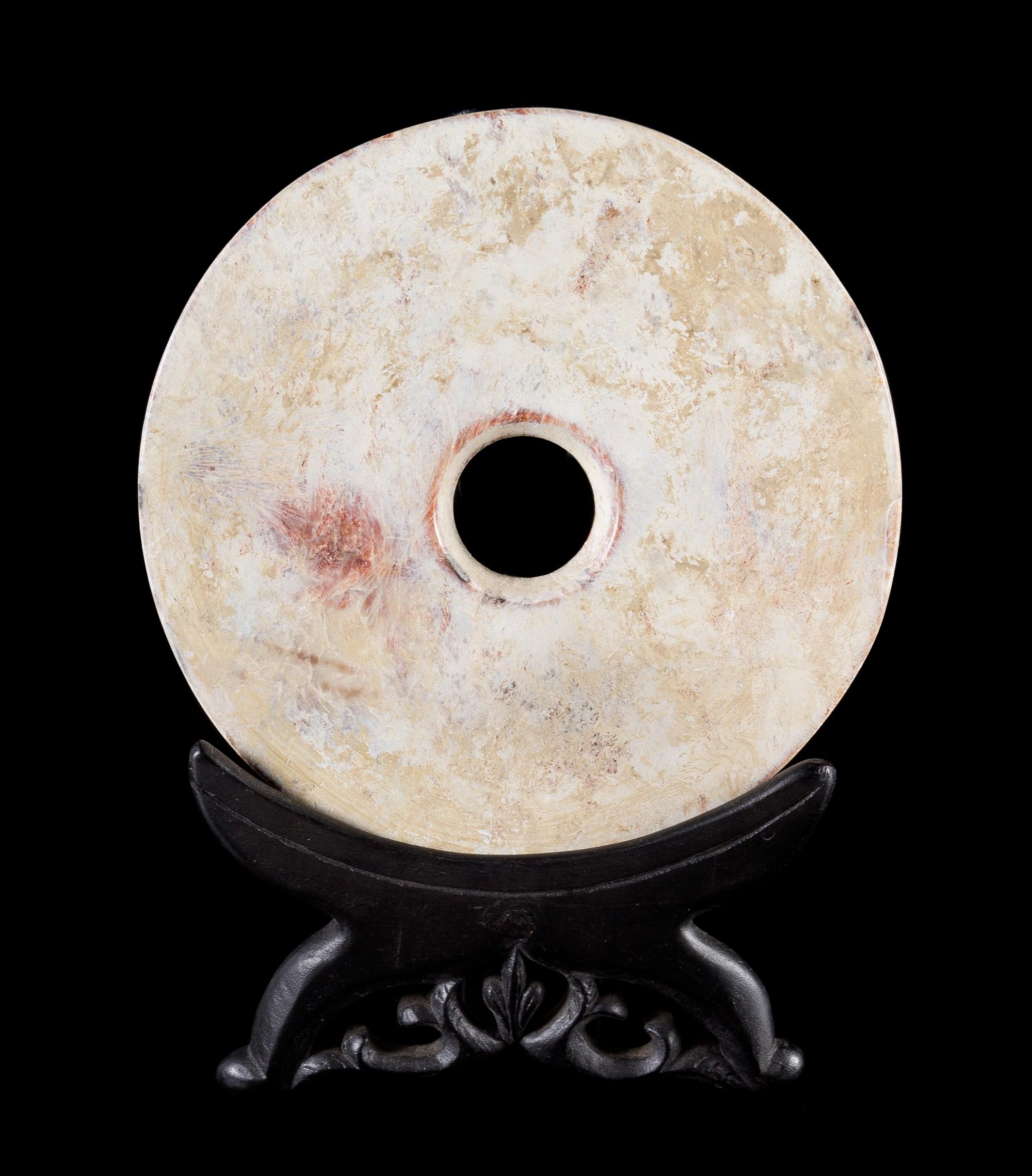 A Chicken Bone Jade Bi Disc Diameter 6 3/4 inches.