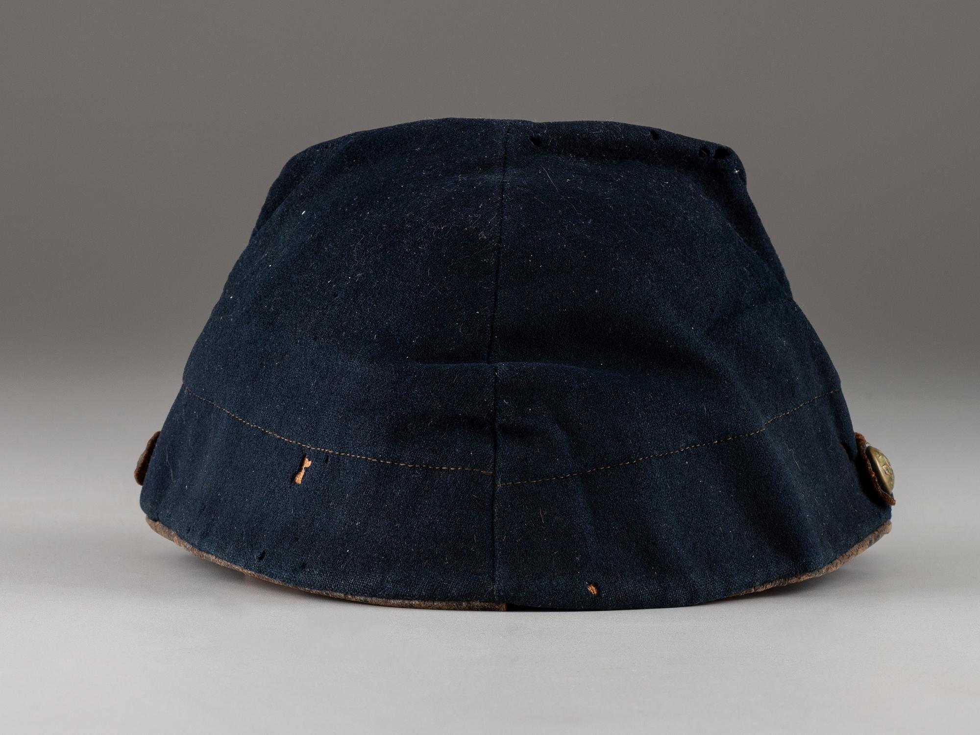 [CIVIL WAR]. Company C, 179th Pennsylvania 1858 forage cap, with identification to J.K. Hunsleker carved into visor.