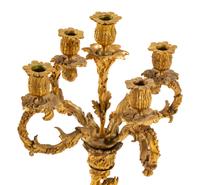 A Pair of Continental Gilt Bronze Figural Five-Light Candelabra with Malachite Veneered Bases