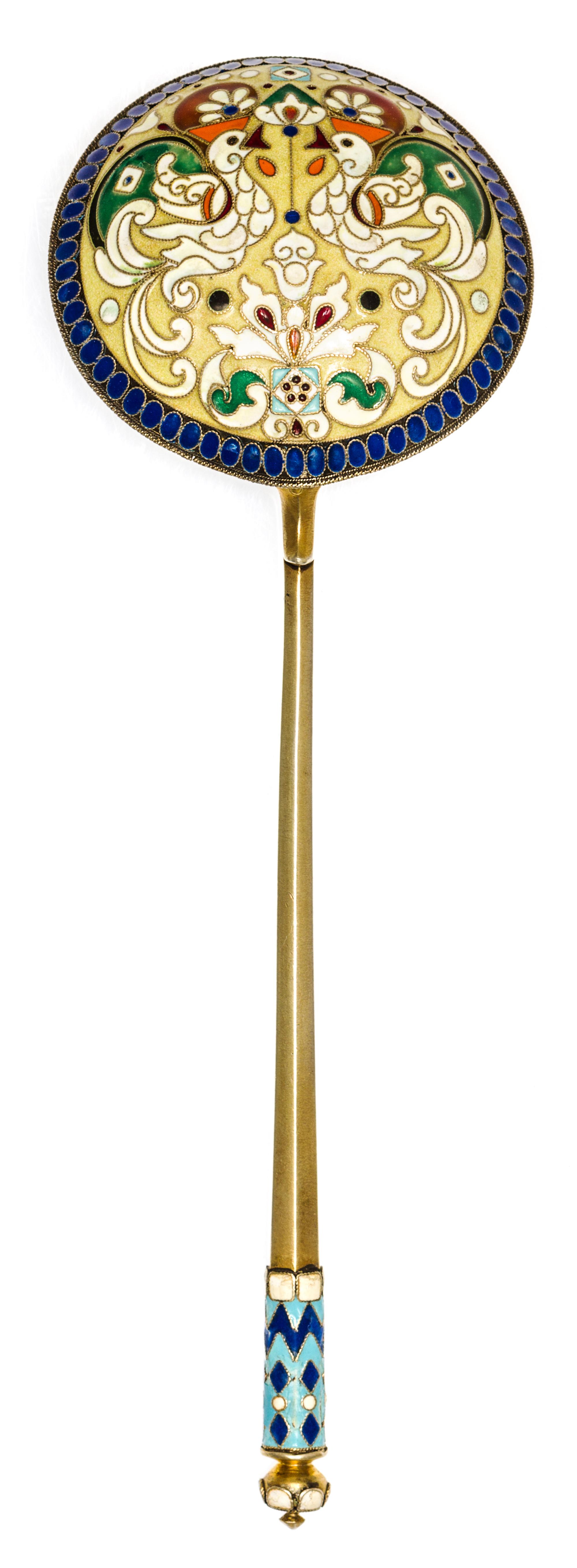 A Russian Silver-Gilt and Enamel Serving Spoon, Mark of 9th Artel, Moscow, early 20th century, having an enameled finial surmounting a
