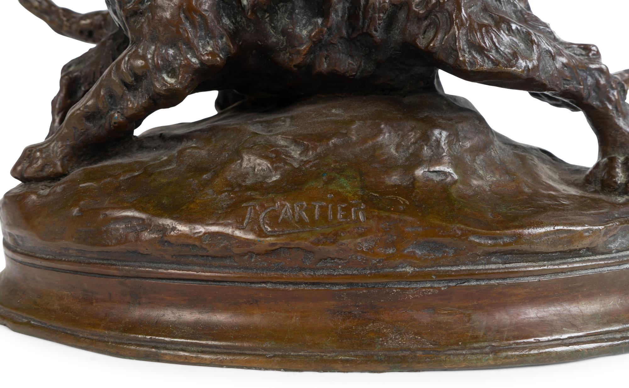 A French Patinated Bronze Group of Dogs — CAST AFTER A MODEL BY THOMAS FRANCOIS CARTIER (FRENCH, 1879-1943)
