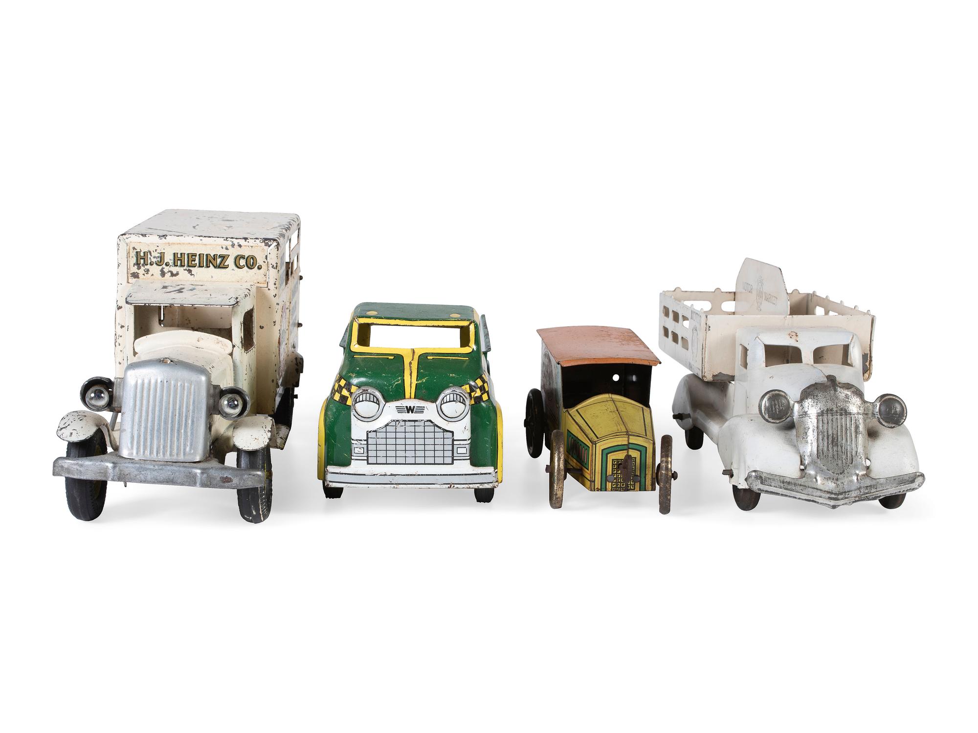 Four Pressed Steel and Tin Lithograph Delivery Trucks