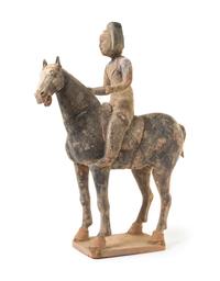 A Chinese Grey Pottery Equestrian Figure Height 19 inches.