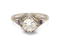 An 18 Karat White Gold, Diamond and Synthetic Sapphire Ring,
