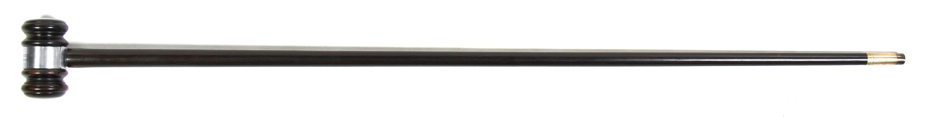 An Ebonized Presentation Cane, Height overall 36 1/2 x width of handle 3 1/8 inches.