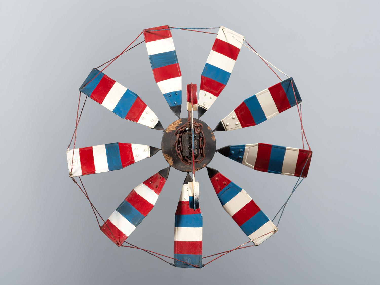 A Patriotic Red, White and Blue Painted Sheet Metal Whirligig