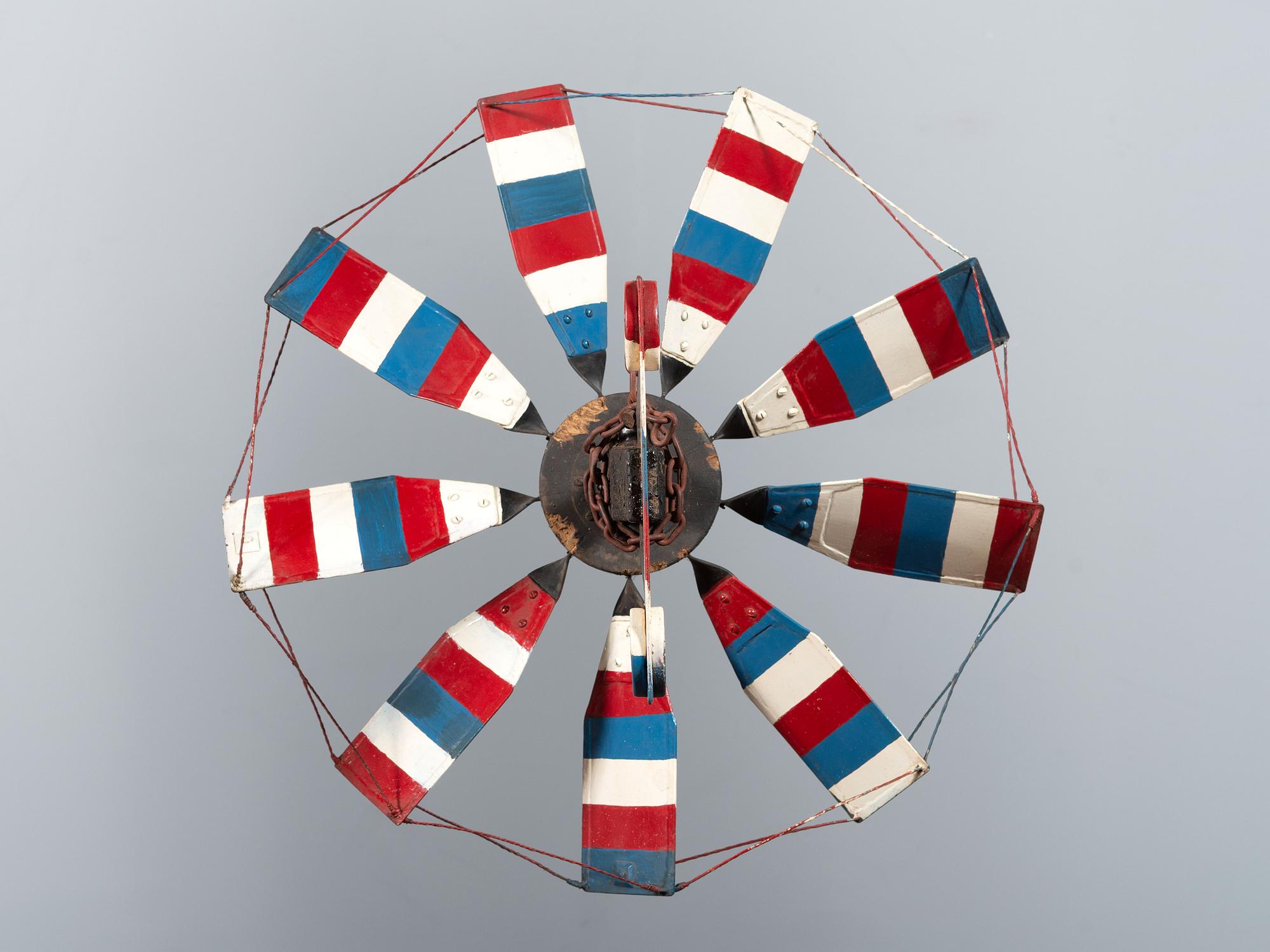 A Patriotic Red, White and Blue Painted Sheet Metal Whirligig