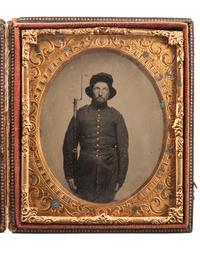 [CIVIL WAR]. Sixth plate ruby ambrotype of an armed soldier, possibly representing the 3rd or 4th New Hampshire Infantry.