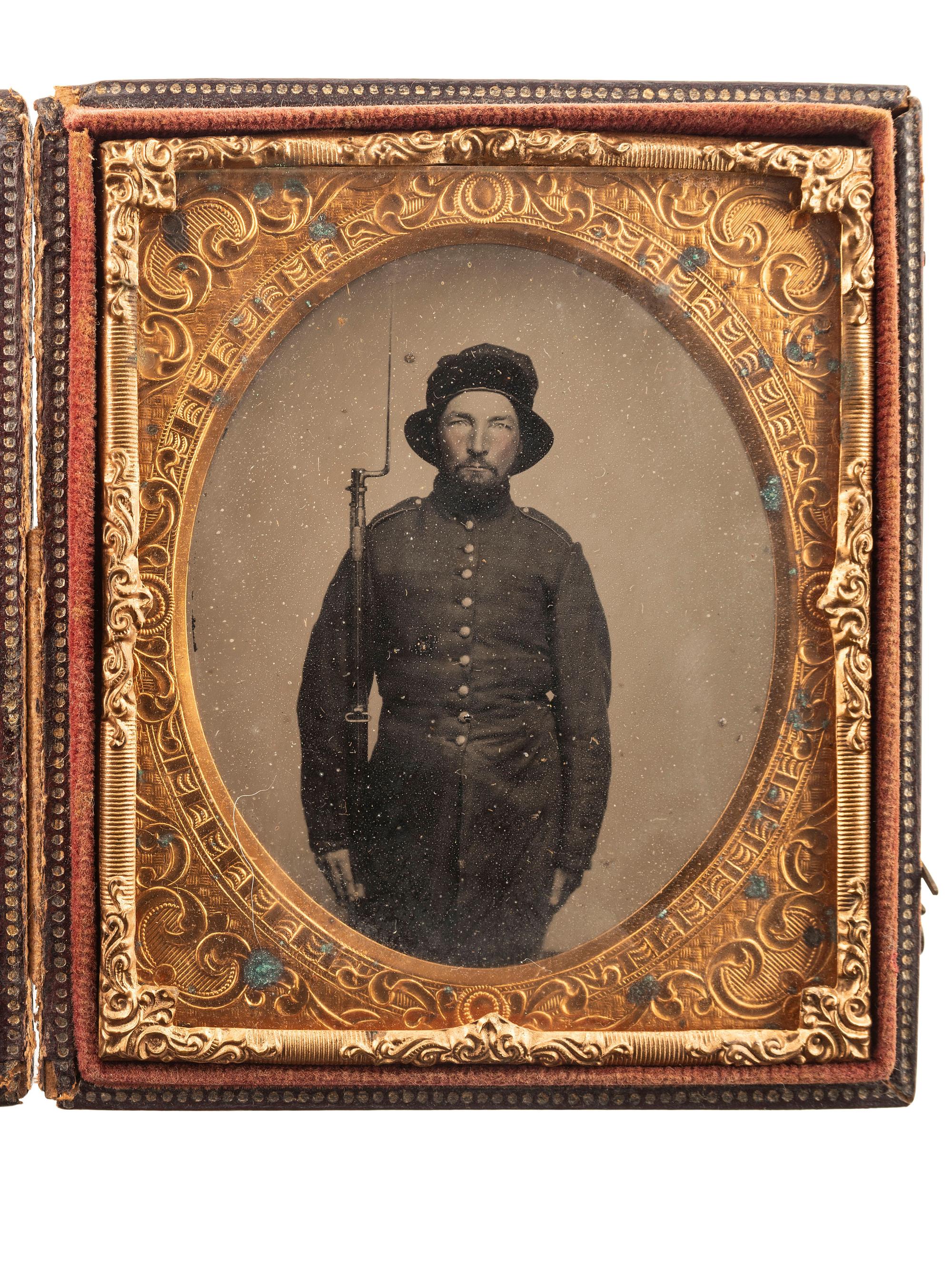 [CIVIL WAR]. Sixth plate ruby ambrotype of an armed soldier, possibly representing the 3rd or 4th New Hampshire Infantry.