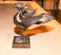 A Southeast Asian Bronze Model of a Bird. Height 8 1/2 inches.
