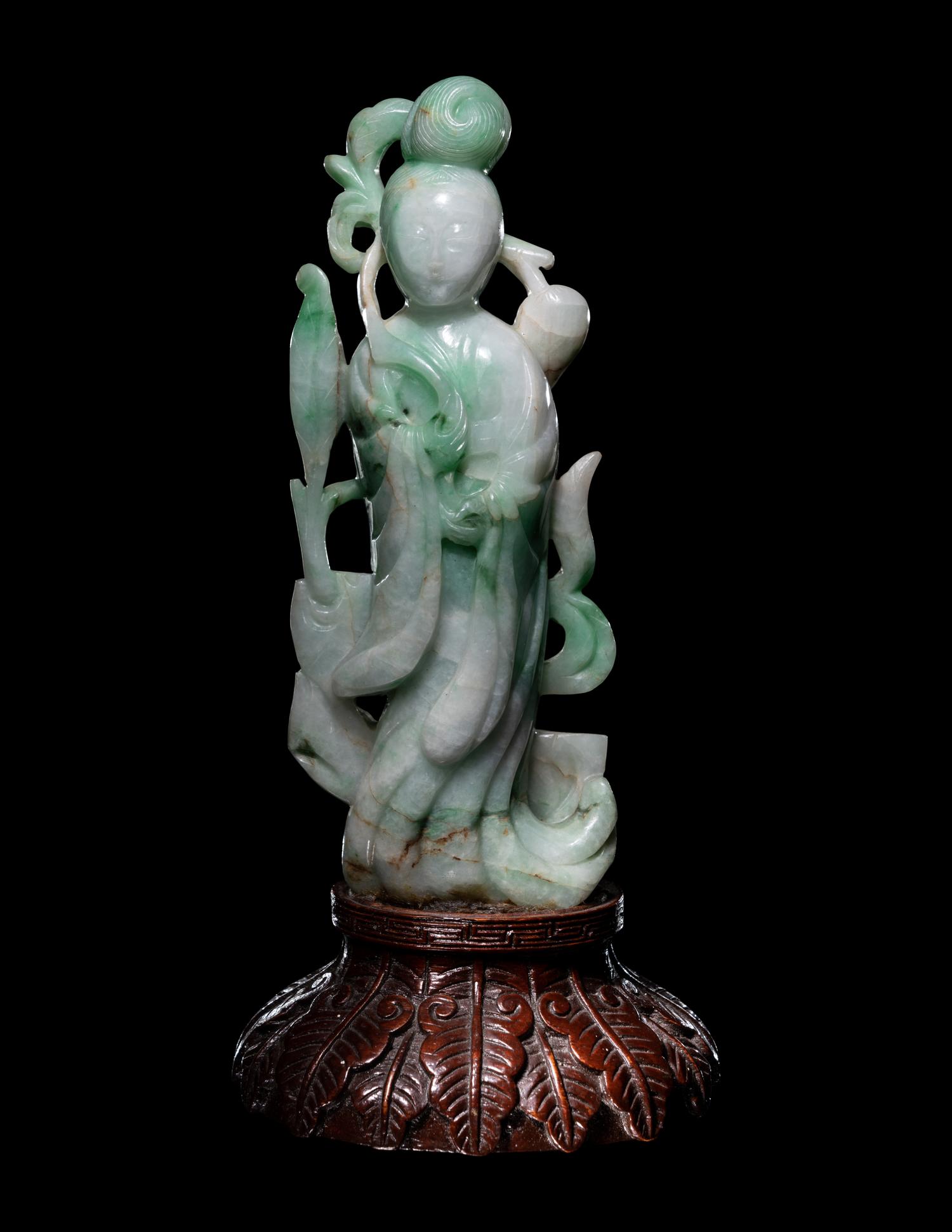 A Chinese Apple Green and Celadon Figure of Female Immortal