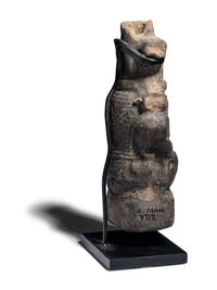 An Egyptian Terracotta Vessel in the form of Bes