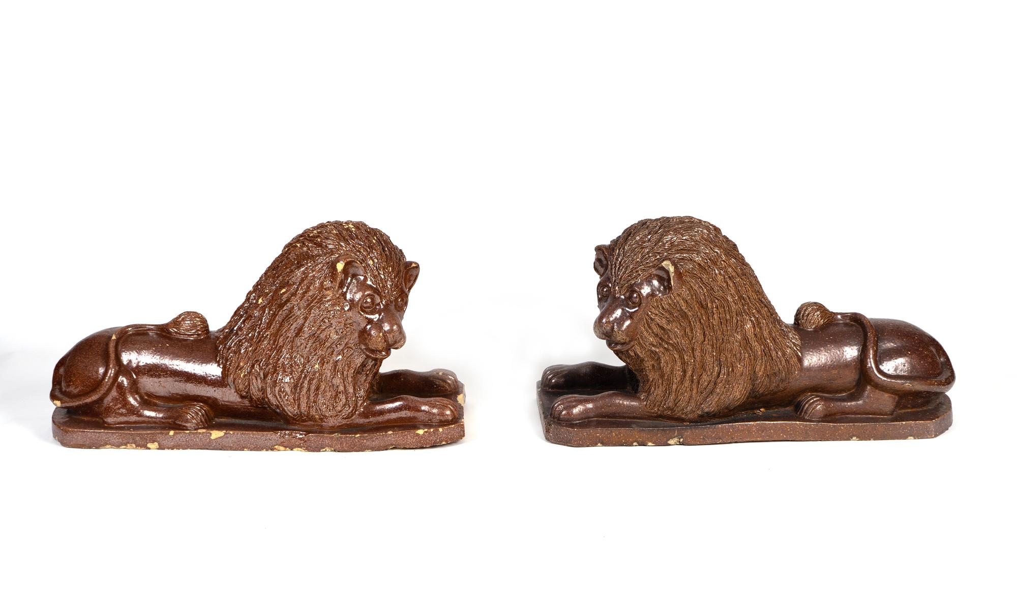 A Set of Four English Brown-Glazed Stoneware Recumbent Lions