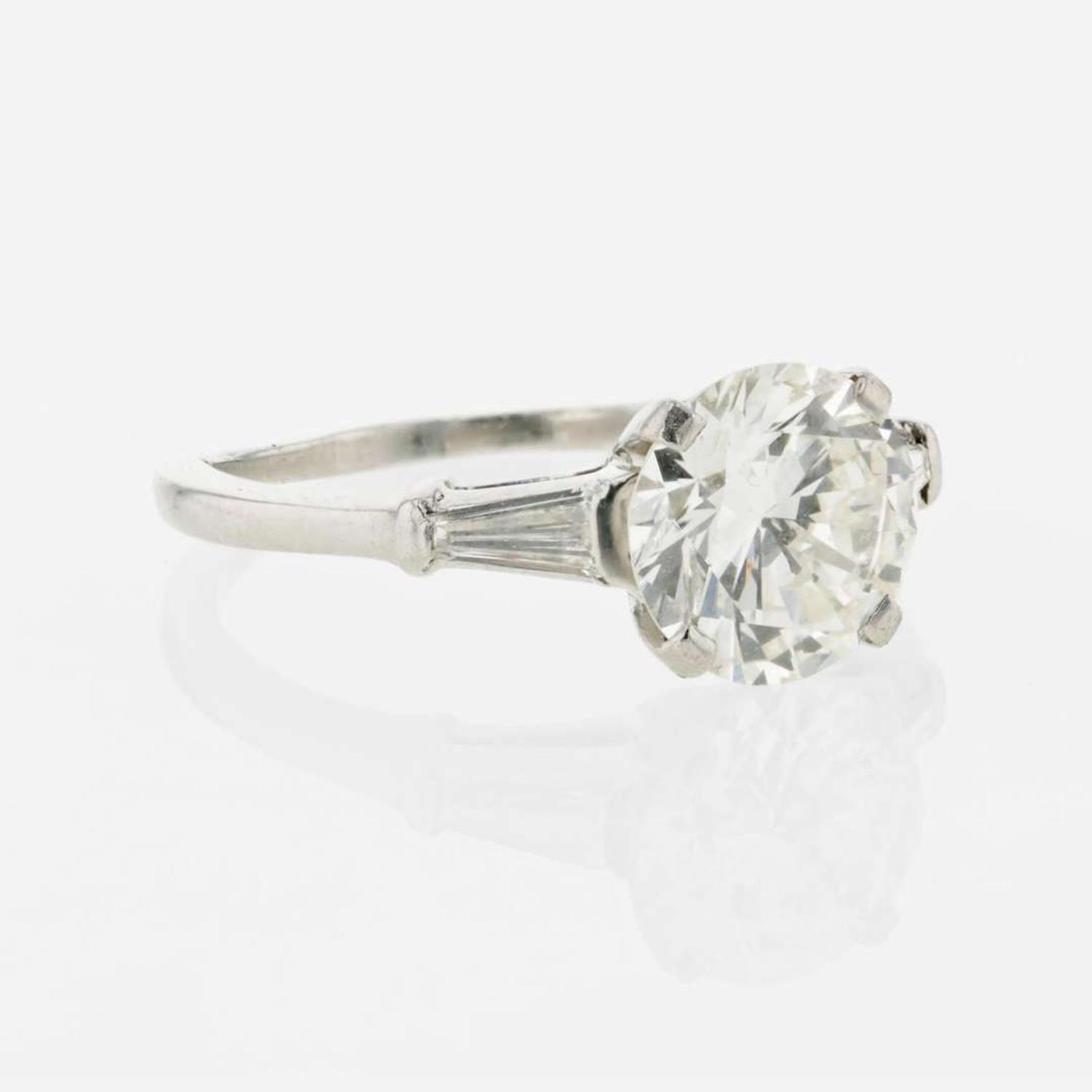 A diamond accented solitaire ring