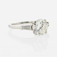 A diamond accented solitaire ring