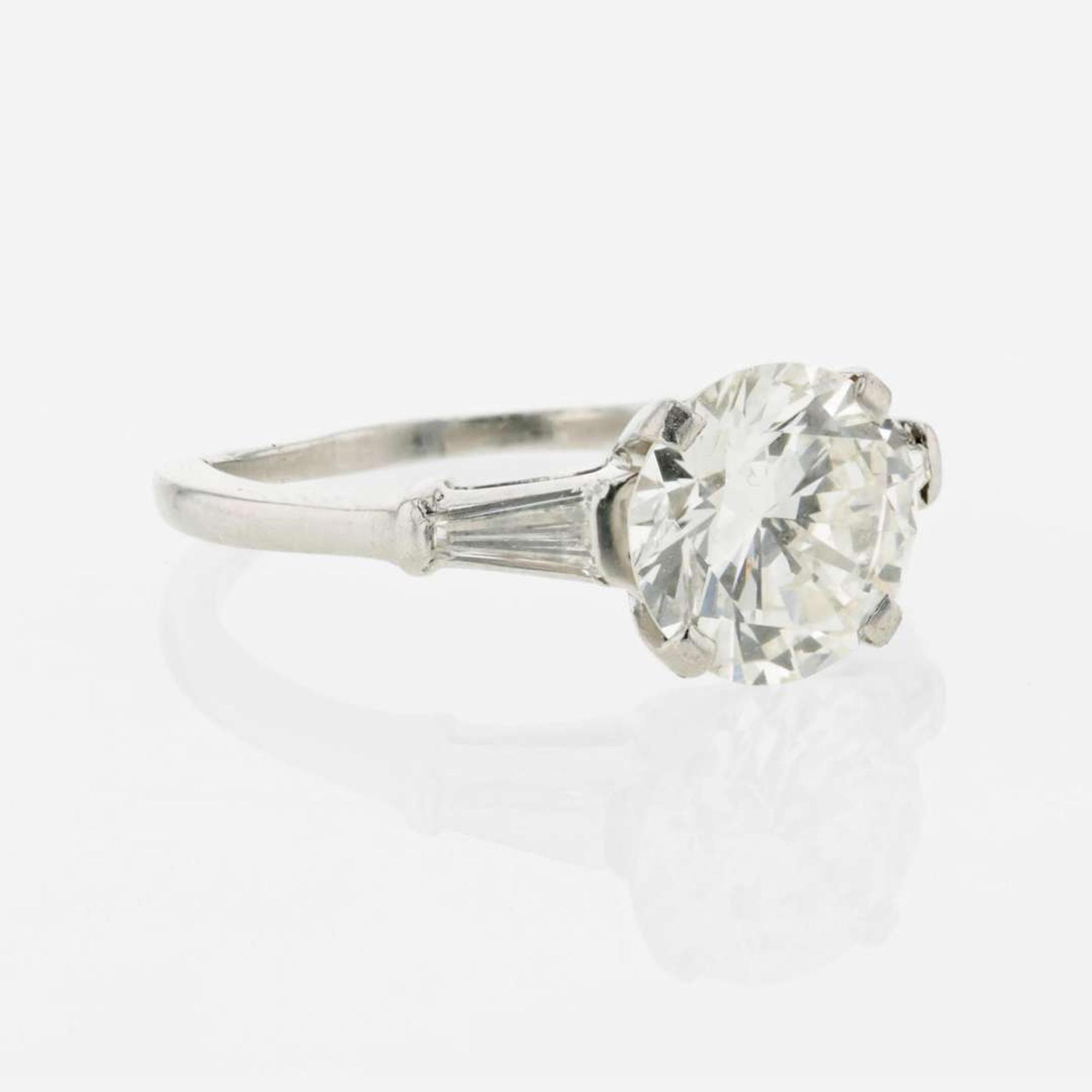 A diamond accented solitaire ring