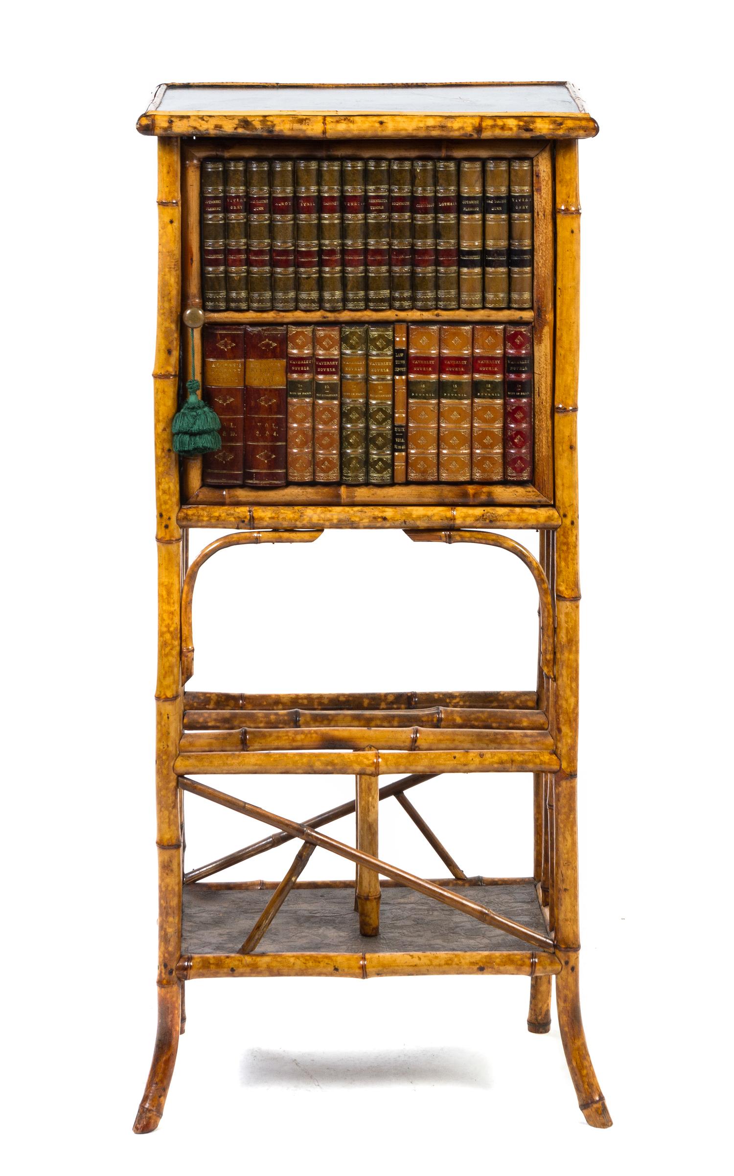A Victorian Lacquered Bamboo and False Book Fronted Cabinet on Stand, Height 46 x width 20 3/4 x depth 14 3/4 inches.