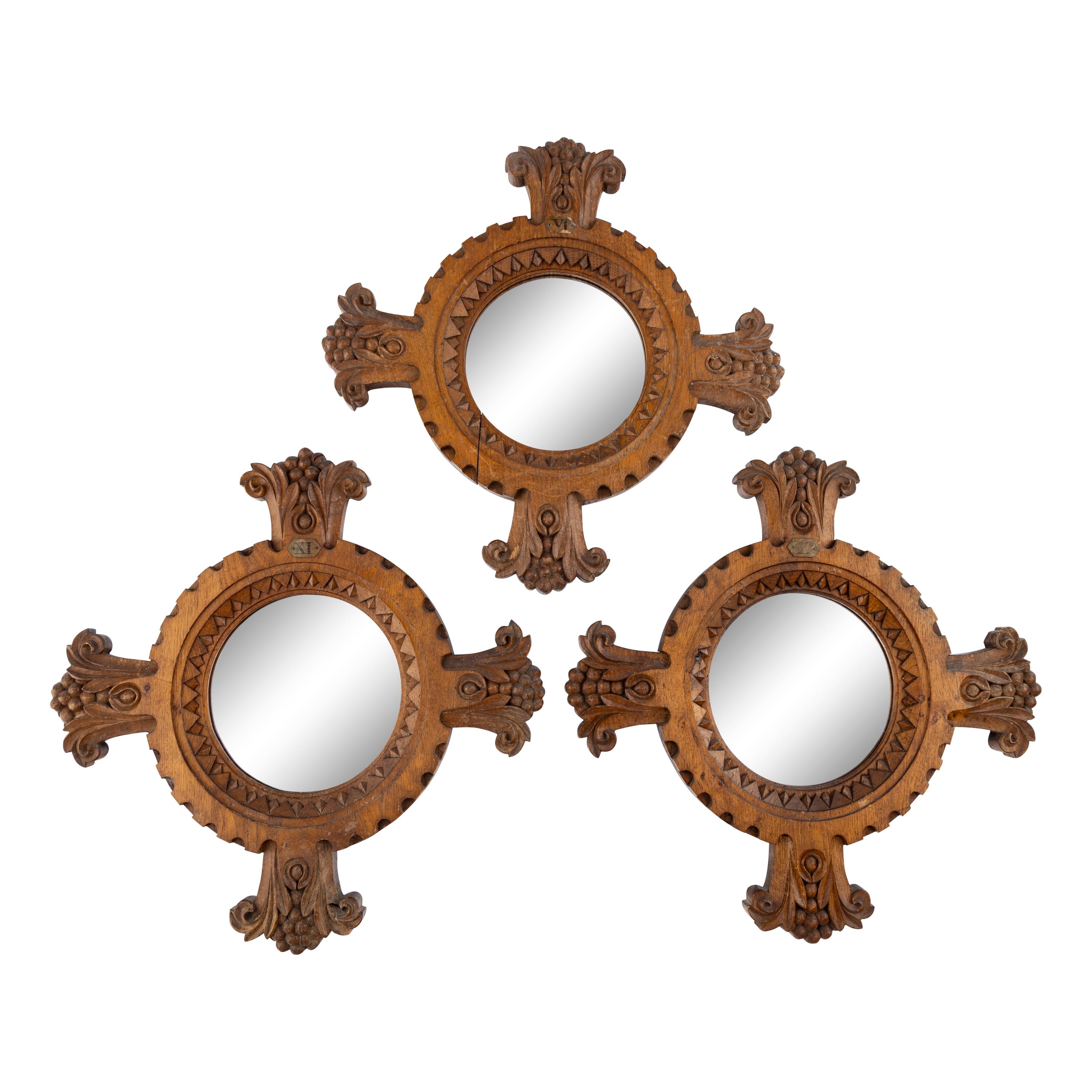 A Group of Three Renaissance Revival Oak Mirrors
