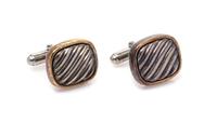 A Pair of Sterling Silver and 14 Karat Yellow Gold Cufflinks, David Yurman, 10.00 dwts.