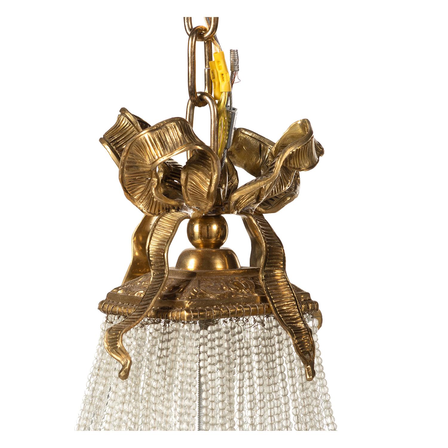 A Louis XVI Style Gilt Metal and Cut Glass Chandelier