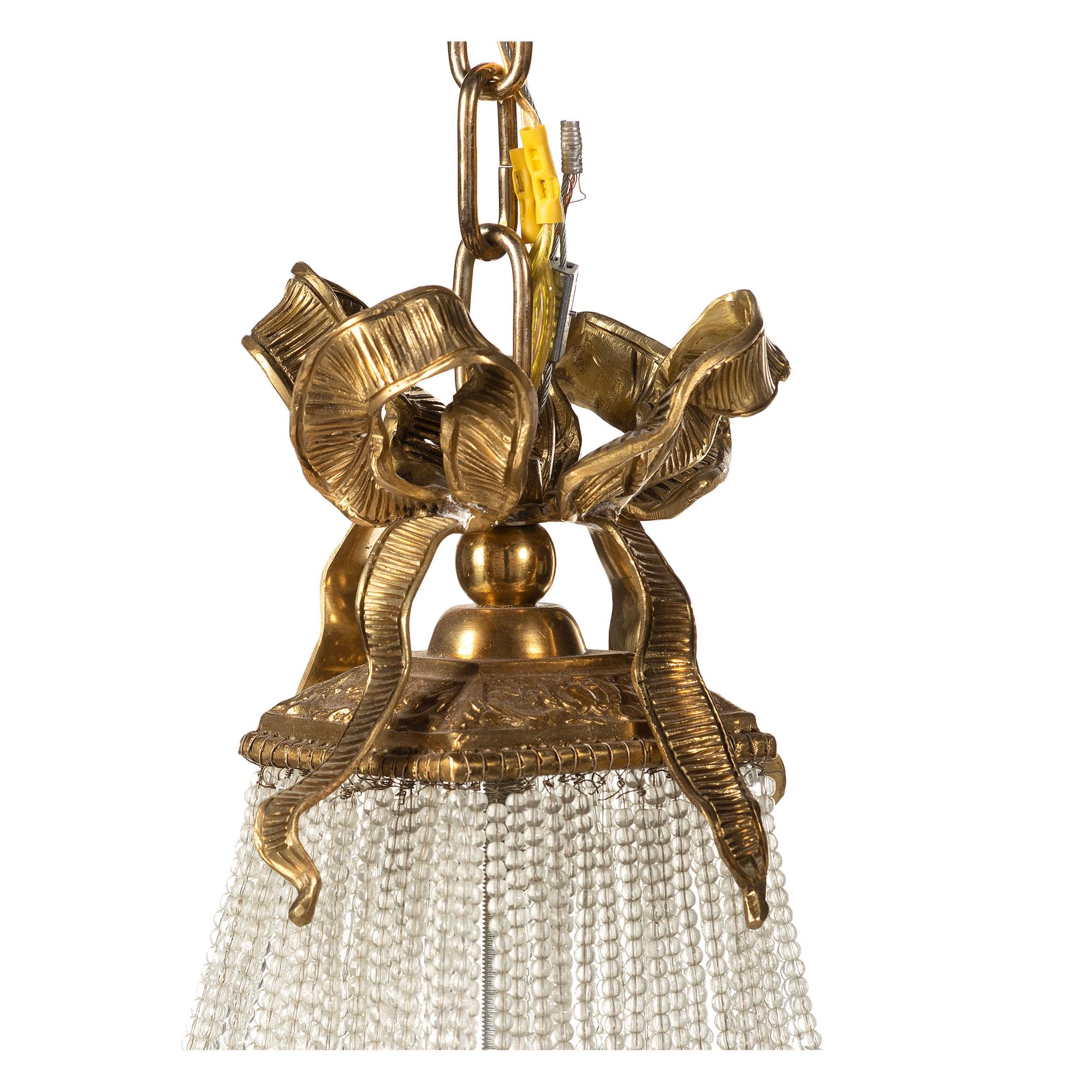 A Louis XVI Style Gilt Metal and Cut Glass Chandelier
