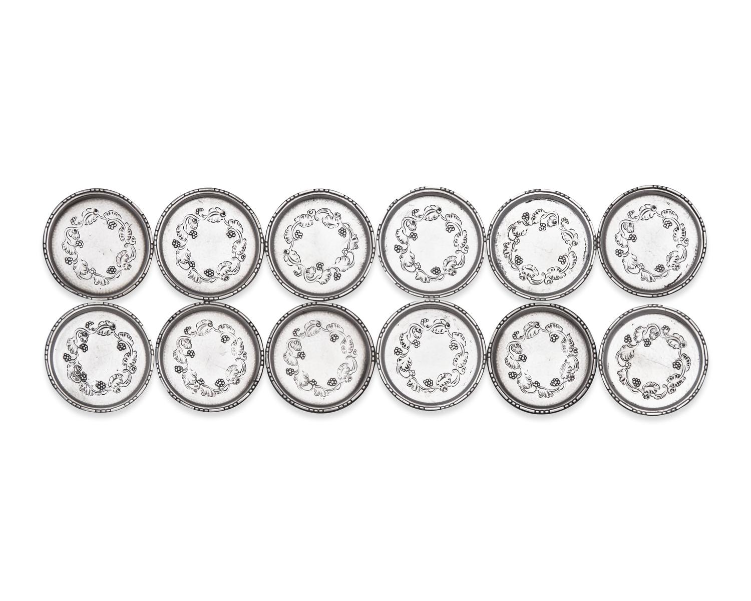 A Set of Twelve Georg Jensen Silver Coasters