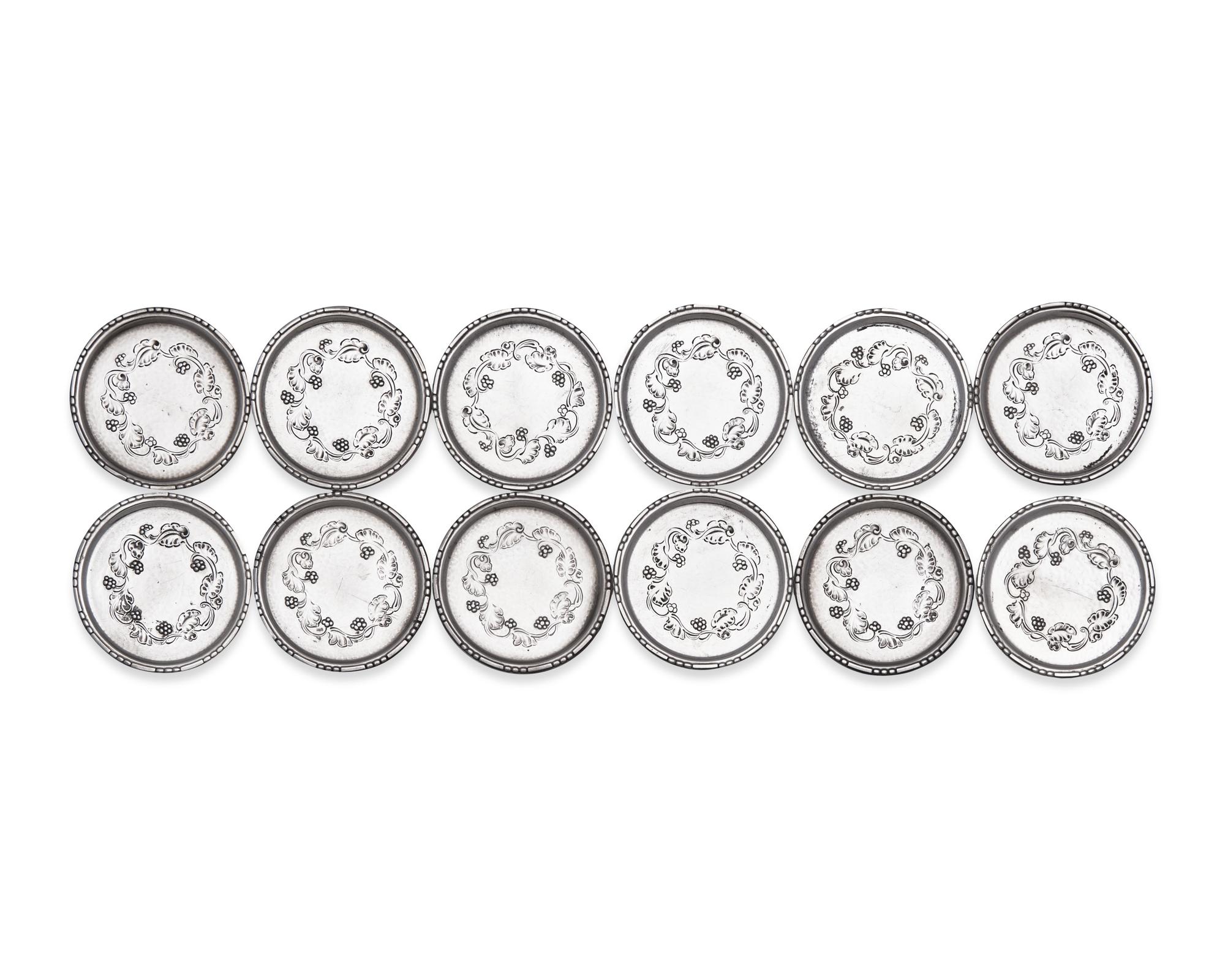 A Set of Twelve Georg Jensen Silver Coasters