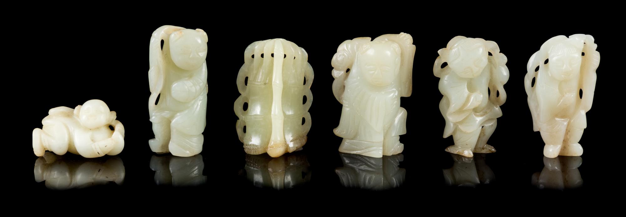 Six Celadon Jade Figures Height of tallest 2 inches.