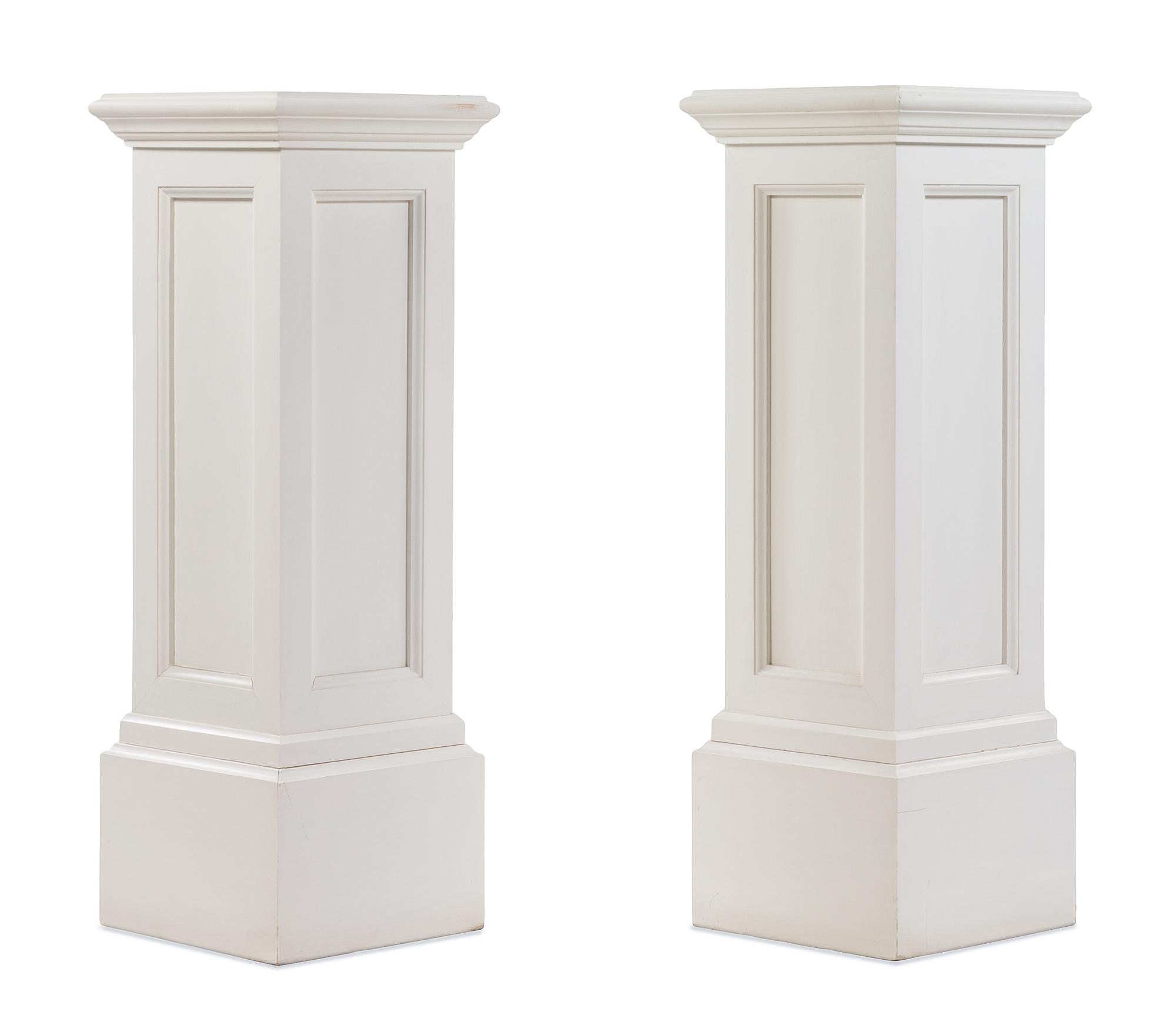 A Pair of White Painted Pedestals Height 39 1/4 x width 13 3/4 x depth 13 3/4 inches. — 20TH CENTURY