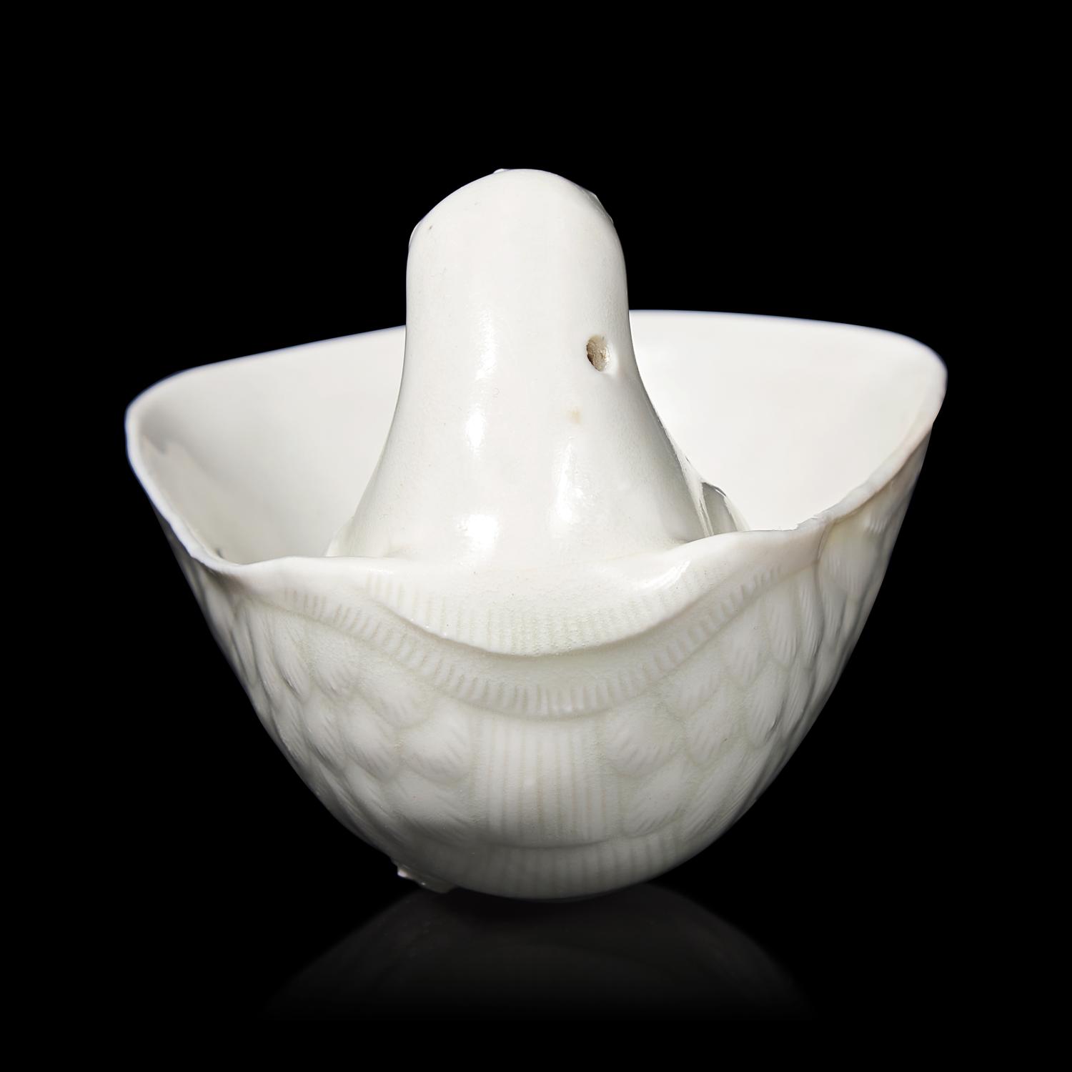 A Chinese Transparent Glazed 'Parrot' Cup, Song Dynasty 宋 白瓷鸚鵡杯