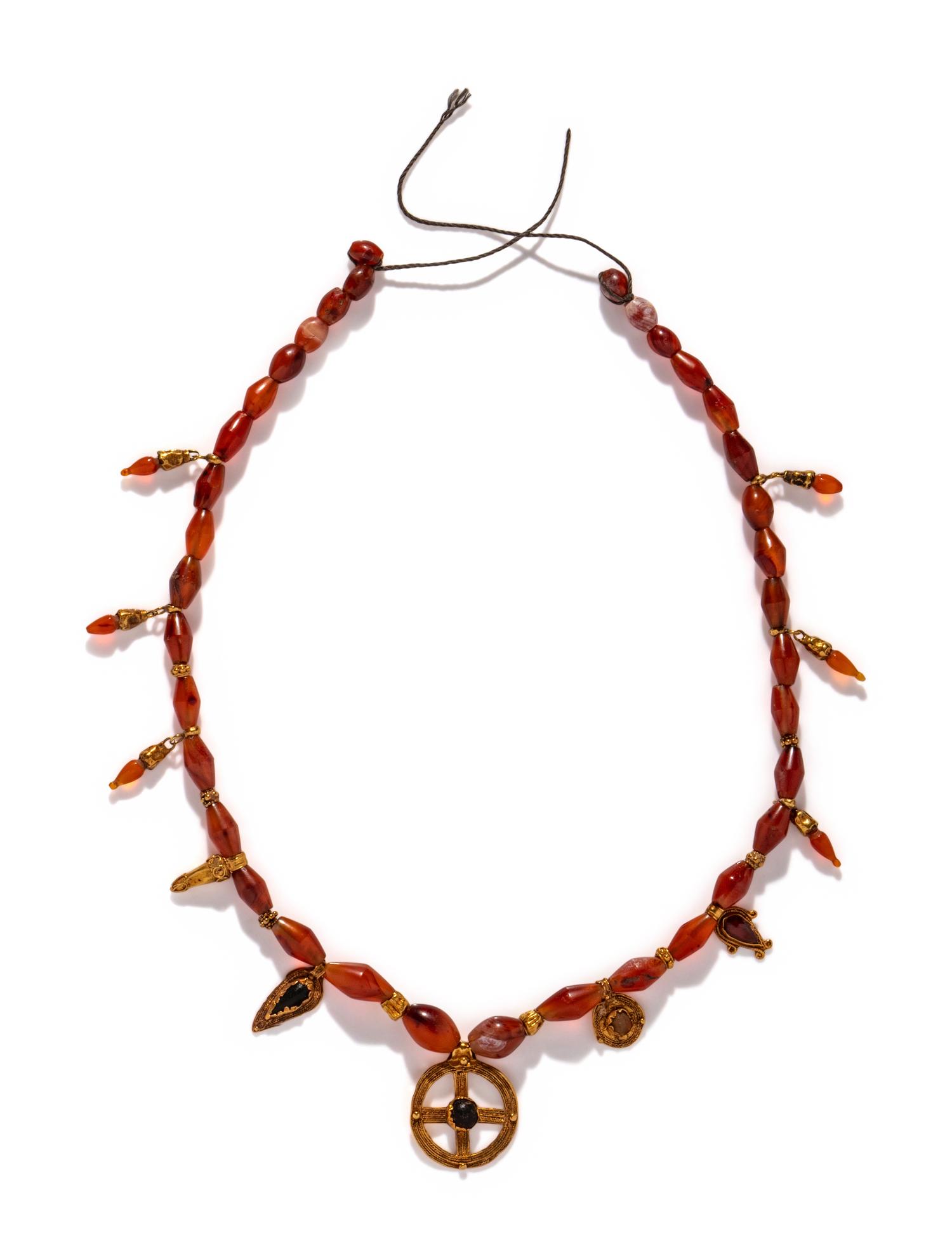 A Hellenistic Gold, Carnelian, and Glass Necklace with Pendants
