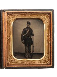 [CIVIL WAR]. Sixth plate tintype of a Federal rifleman armed with target rifle and revolver.