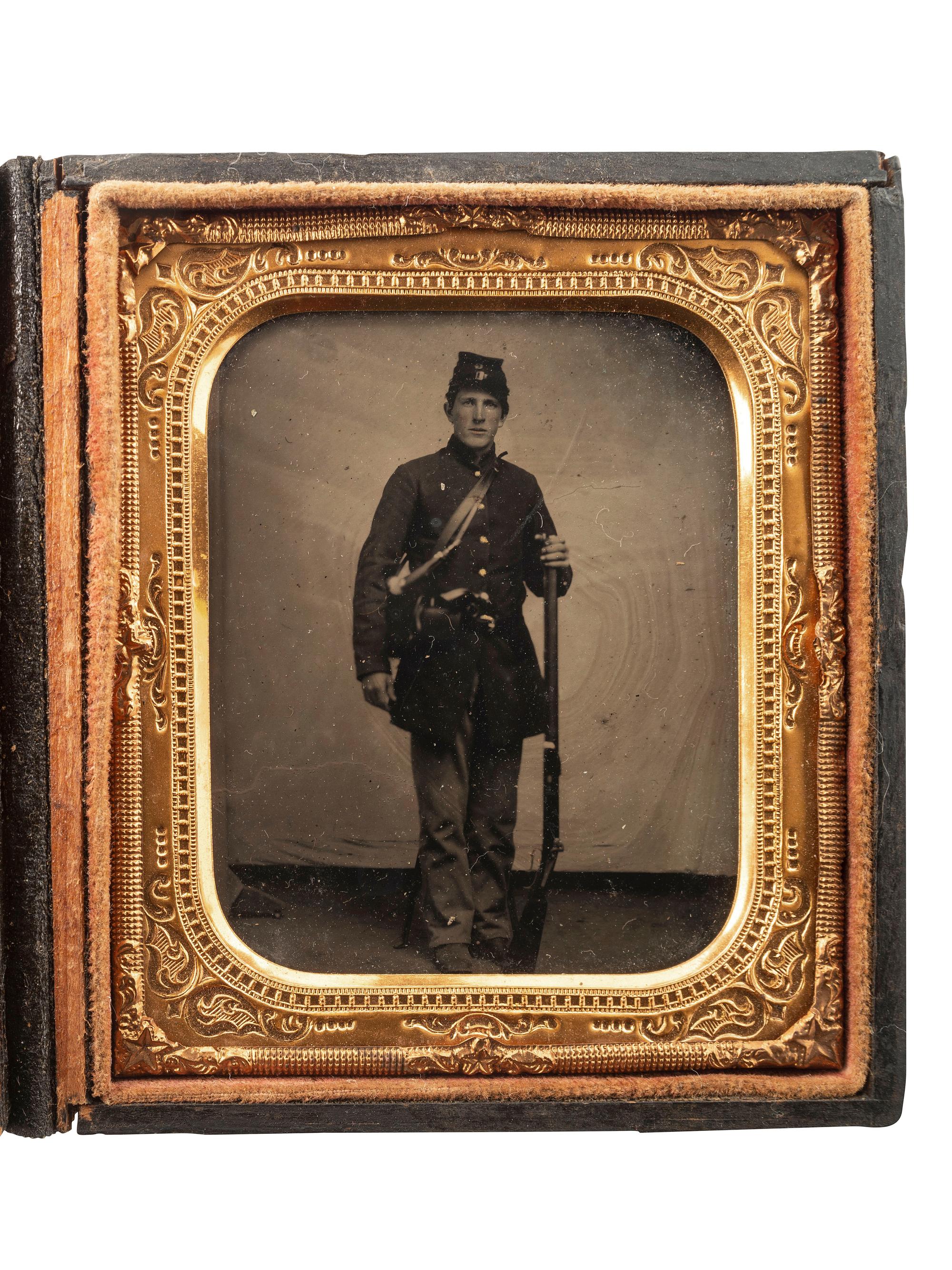 [CIVIL WAR]. Sixth plate tintype of a Federal rifleman armed with target rifle and revolver.