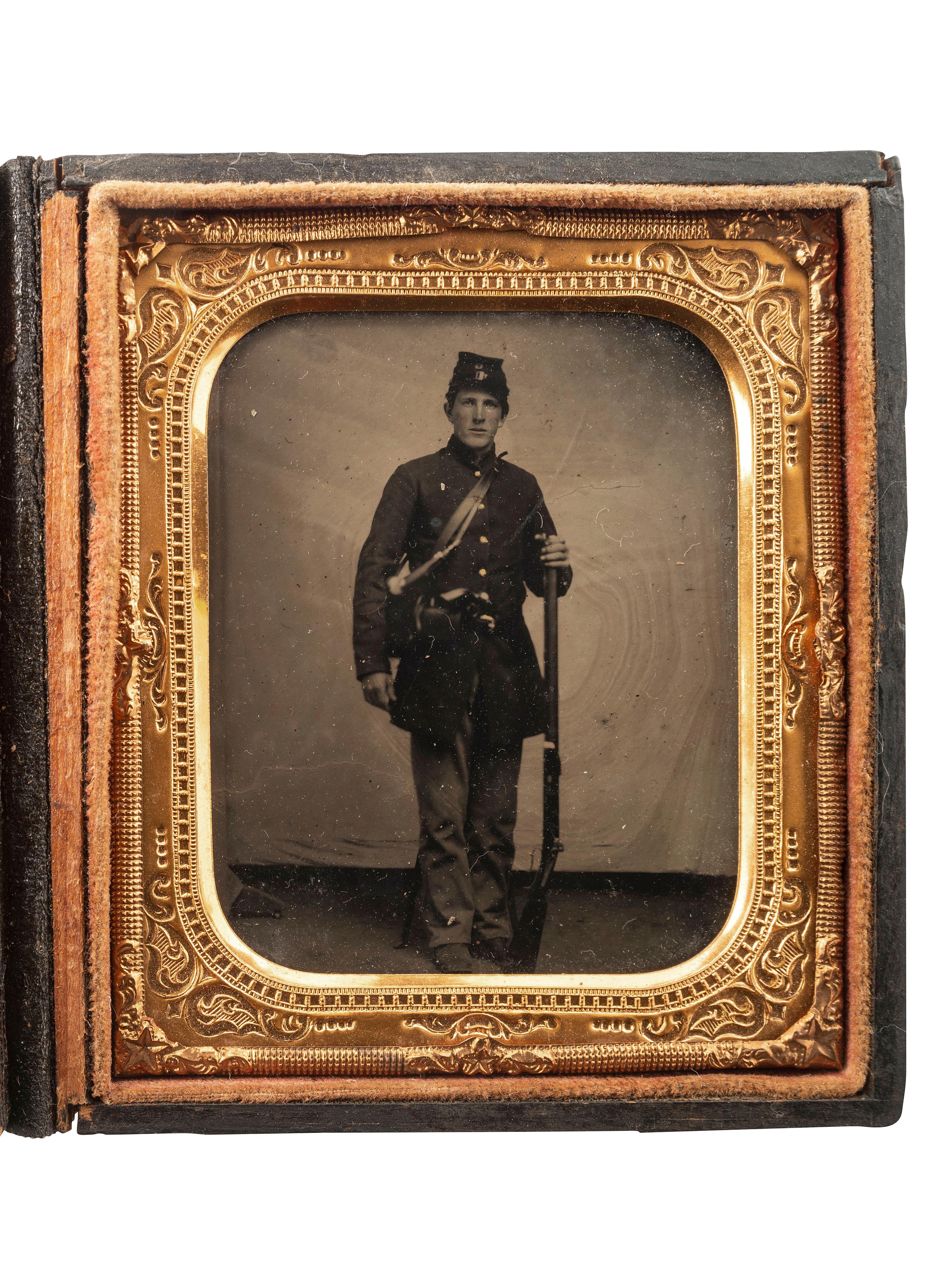 [CIVIL WAR]. Sixth plate tintype of a Federal rifleman armed with target rifle and revolver.