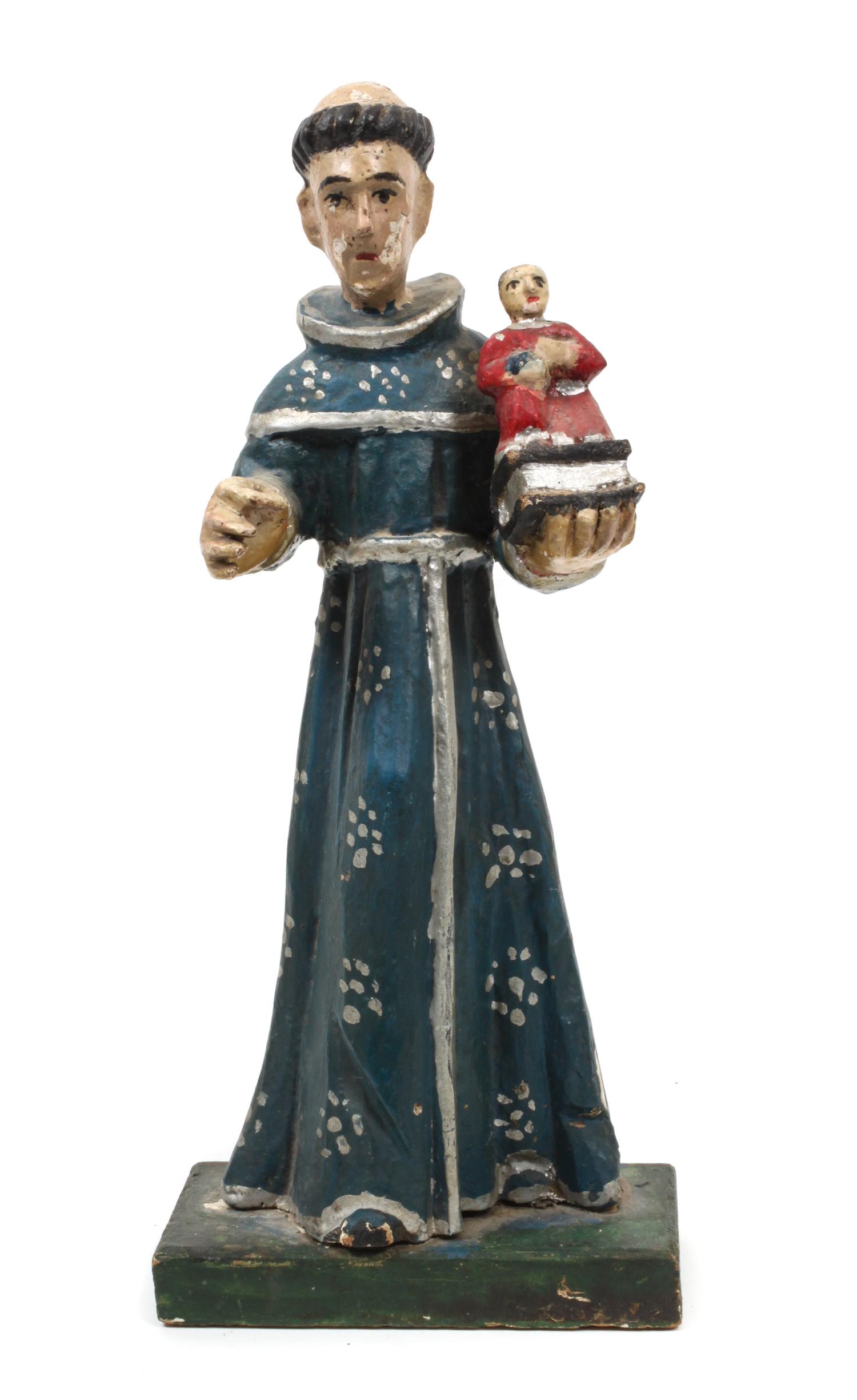 A New Mexican Carved and Painted Wood Bulto Height 13 1/2 inches.