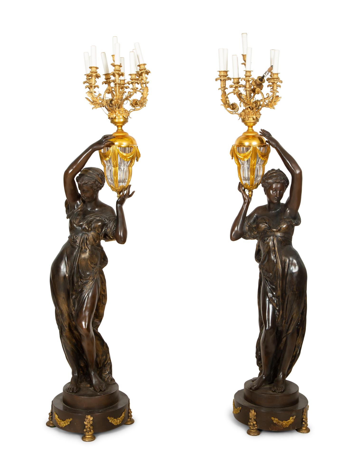 A Pair of French Gilt and Patinated Bronze Figural Nine-Light Torchères