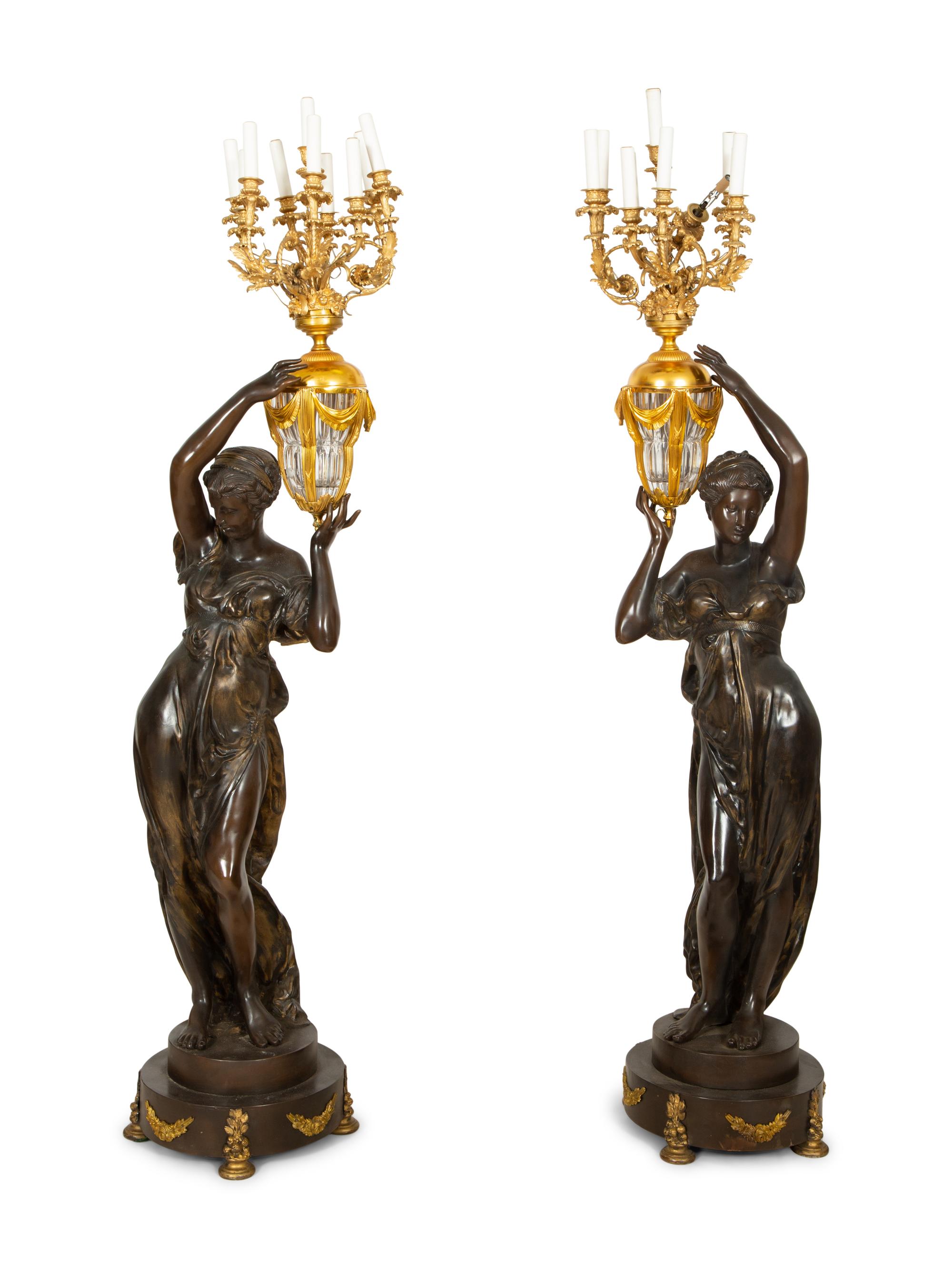 A Pair of French Gilt and Patinated Bronze Figural Nine-Light Torchères
