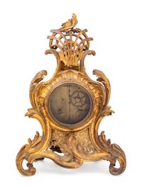 A Louis XV Gilt Bronze Clock and Stand