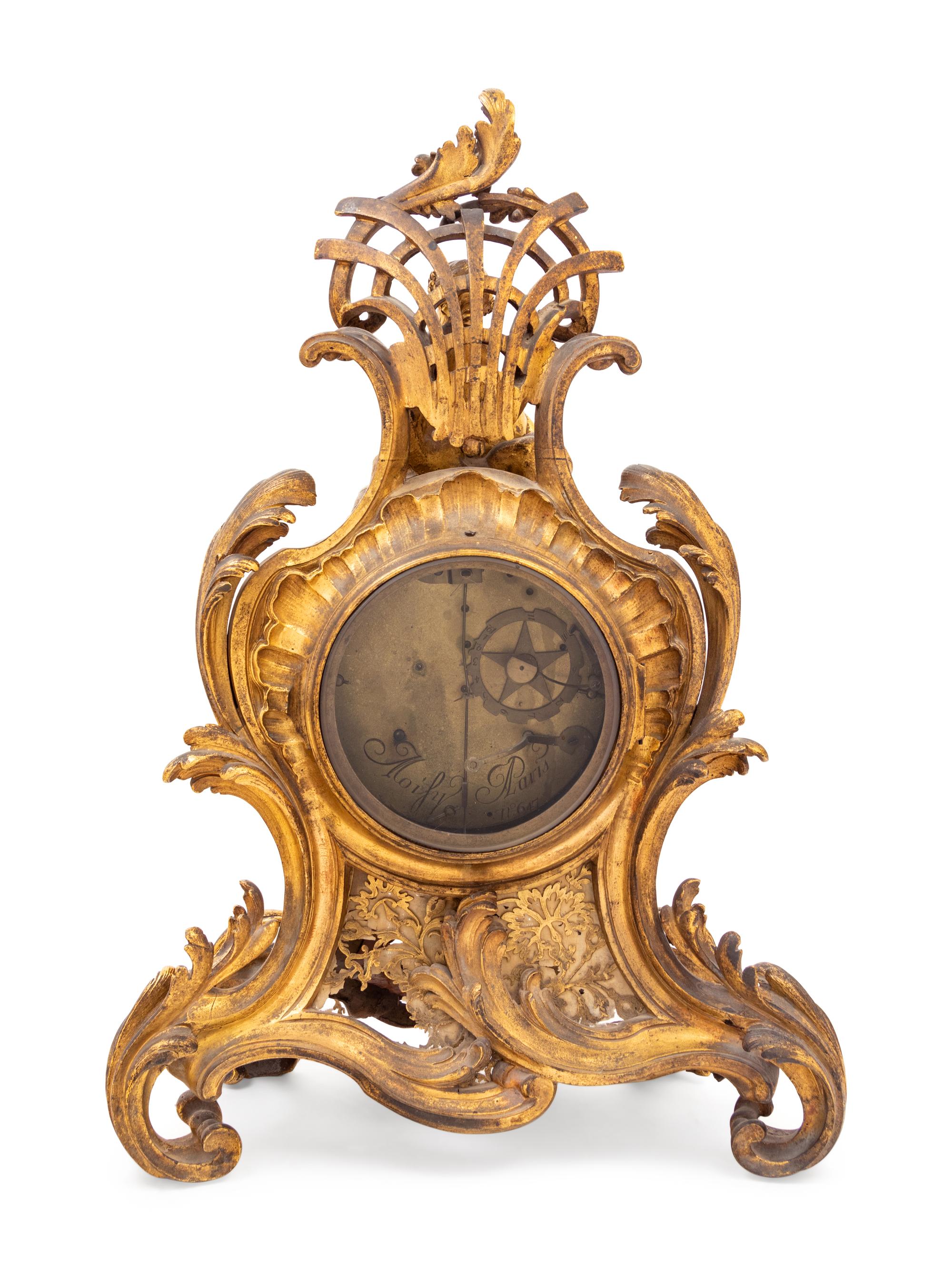 A Louis XV Gilt Bronze Clock and Stand