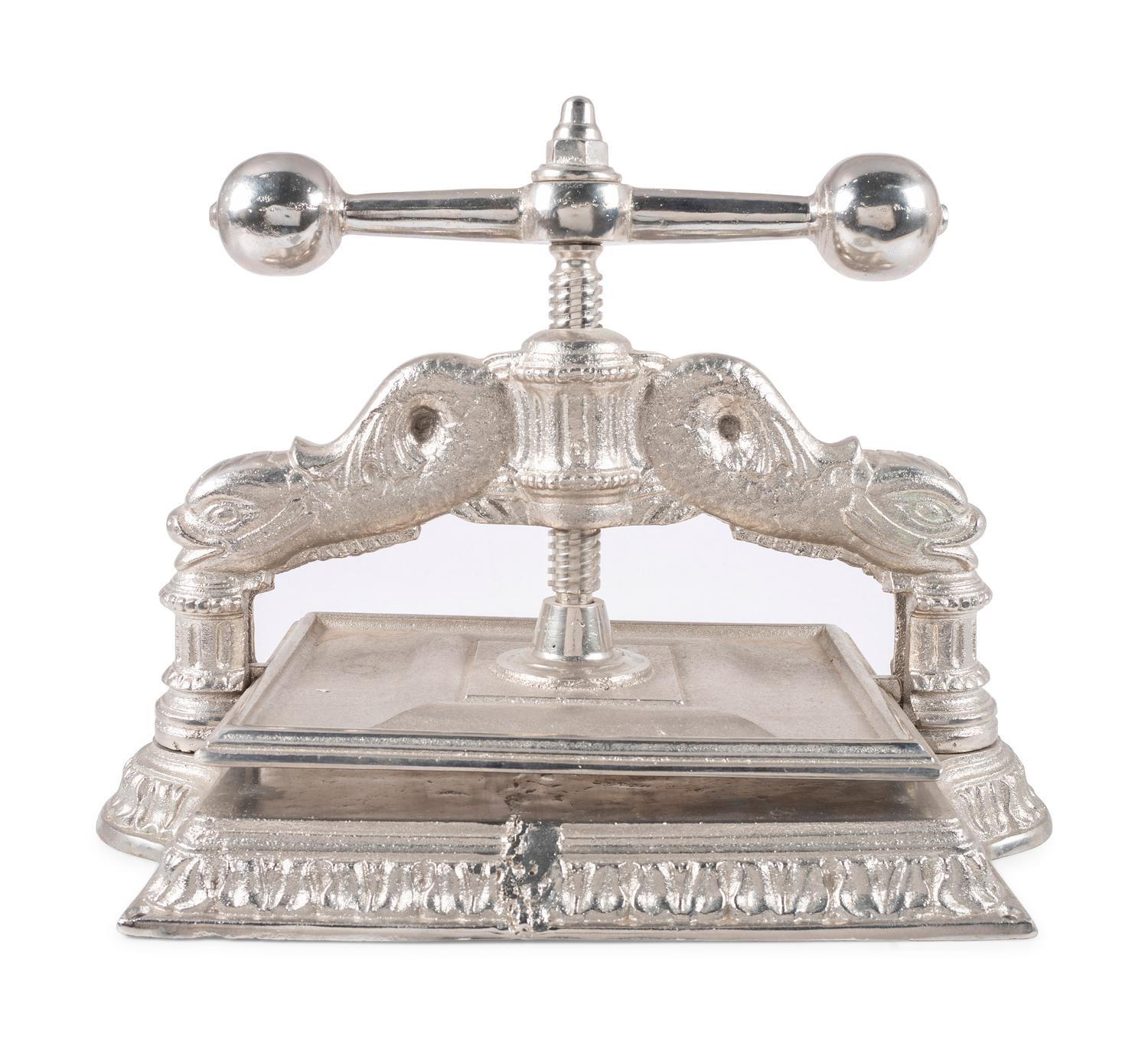 A Dolphin Form Silvered Metal Book Press