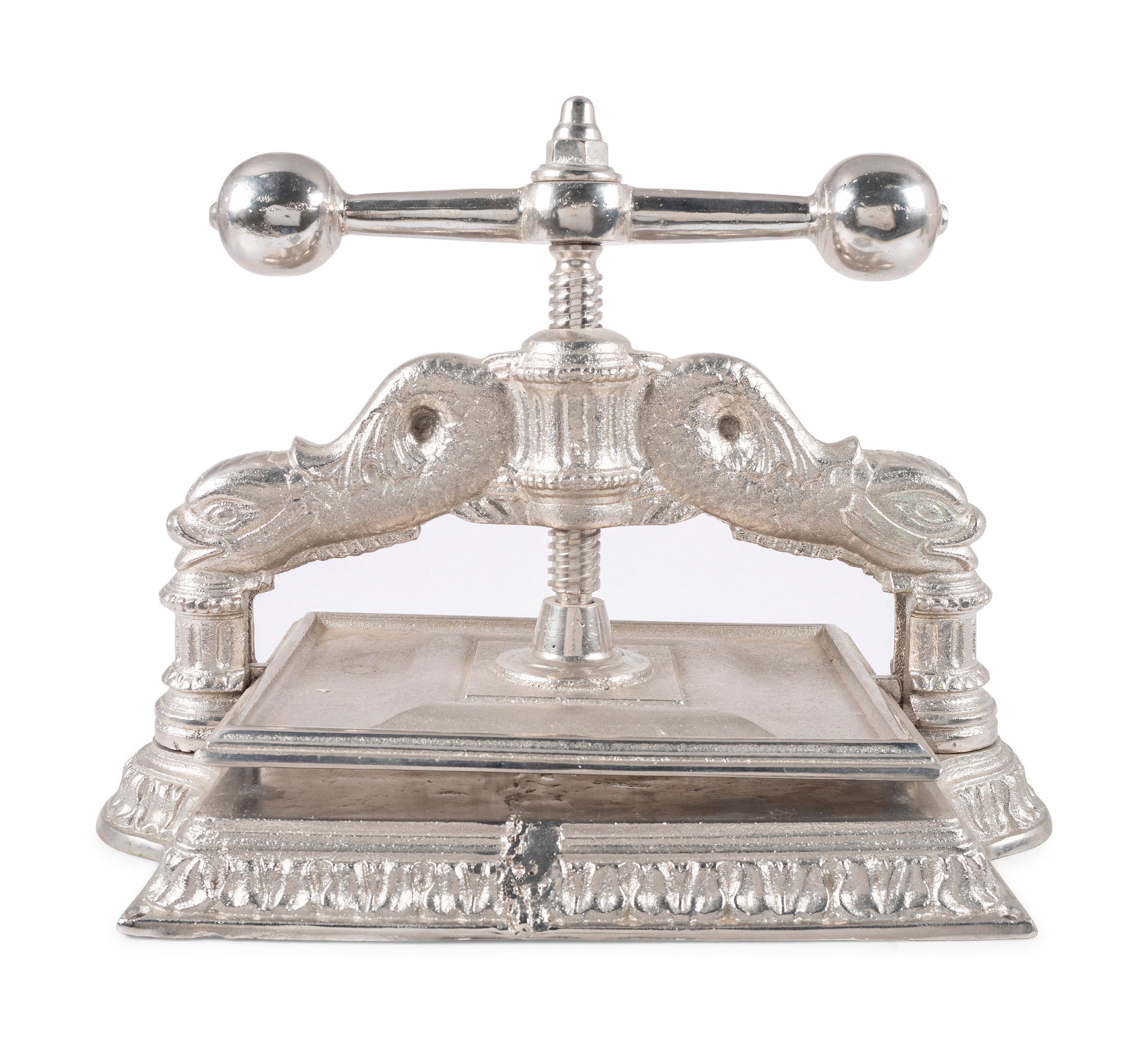 A Dolphin Form Silvered Metal Book Press