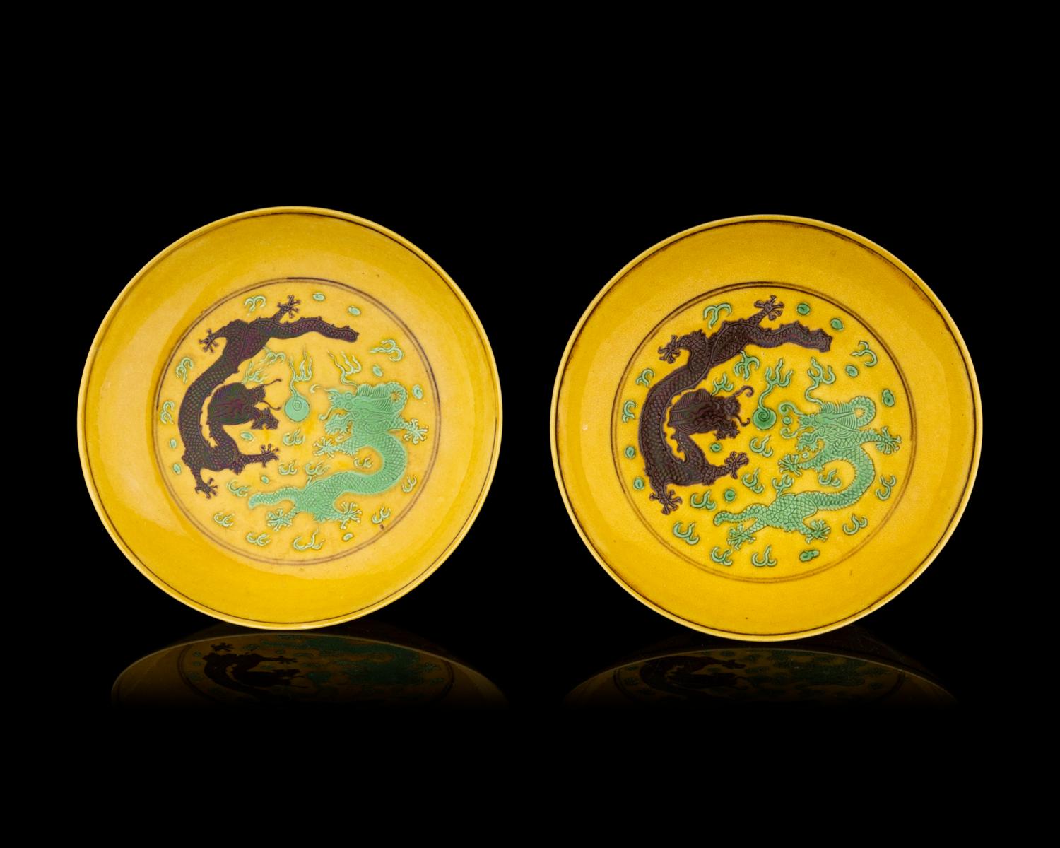 A Pair of Chinese Yellow Ground Green and Aubergine Enameled Porcelain 'Double Dragon' Dishes