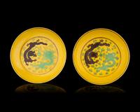 A Pair of Chinese Yellow Ground Green and Aubergine Enameled Porcelain 'Double Dragon' Dishes