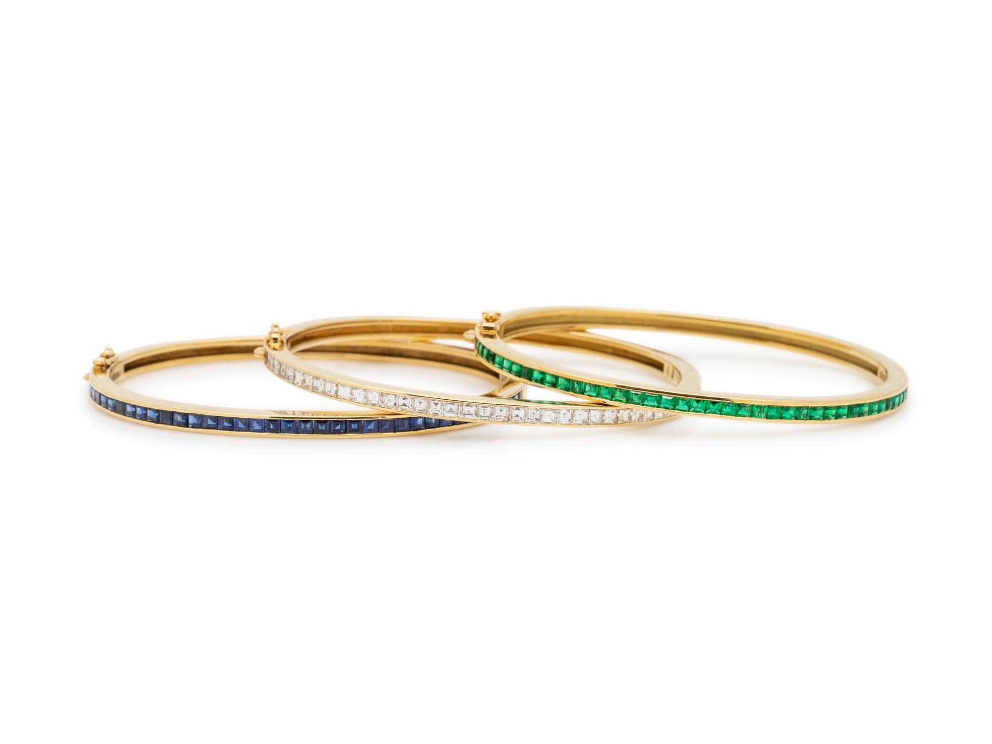 SCHLUGER, DIAMOND, SAPPHIRE AND EMERALD BANGLE BRACELET SET