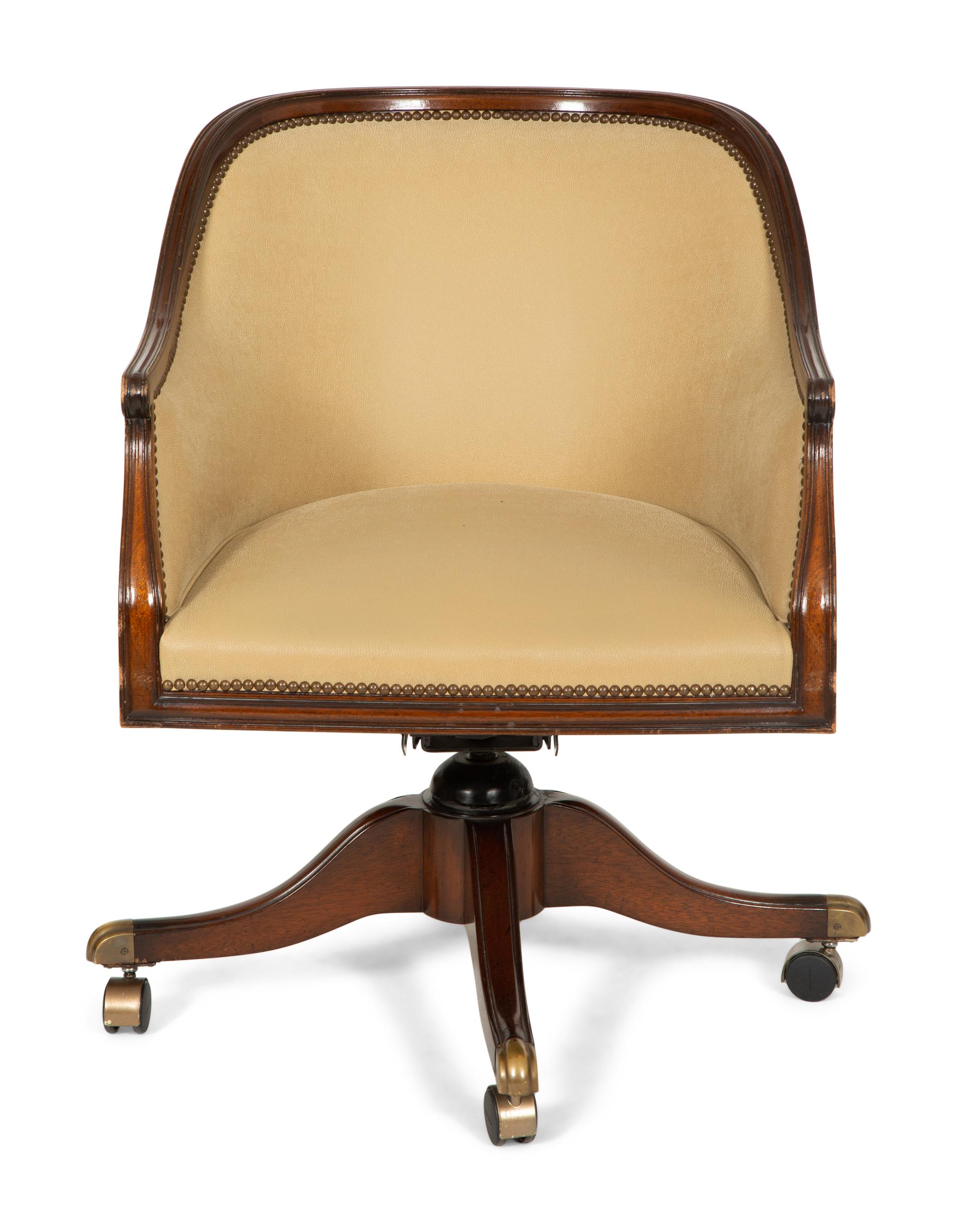 A Regency Style Mahogany Barrell Back Swivel Desk Chair